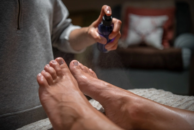 Finishing herbal mist is applied to the feet post pedicure