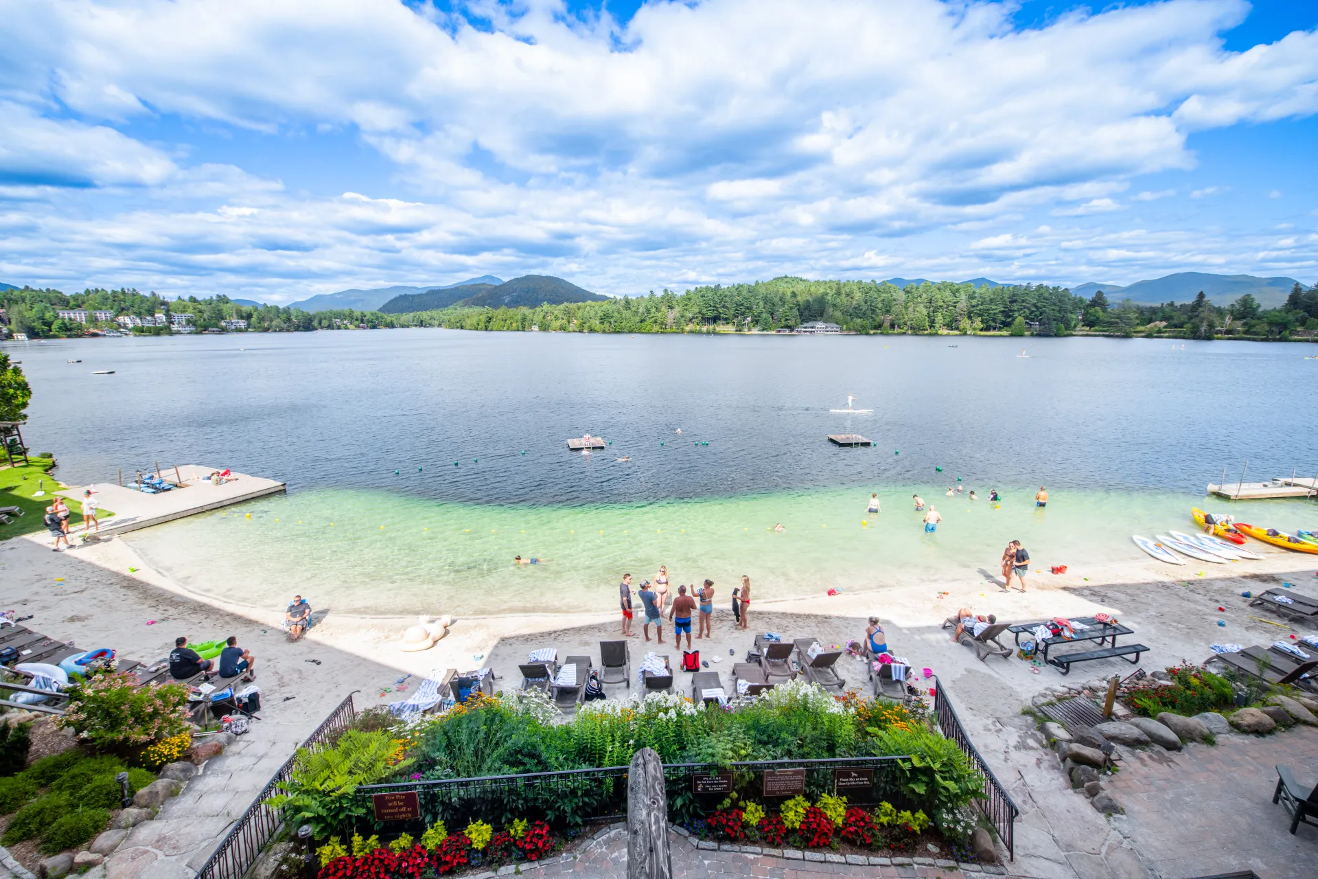 A view of the white sandy beach on Mirror Lake at Golden Arrow Lakeside Resort.