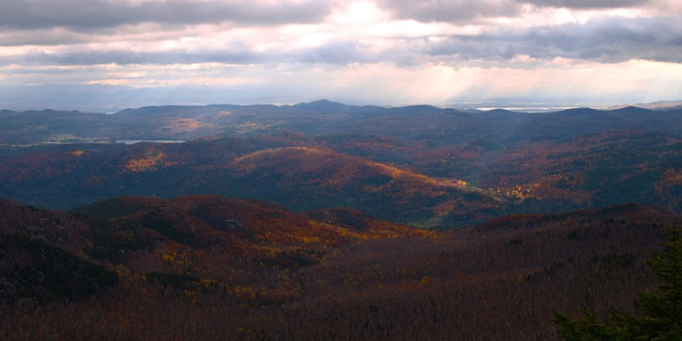 The sunshine through the clouds intensifies the colors.