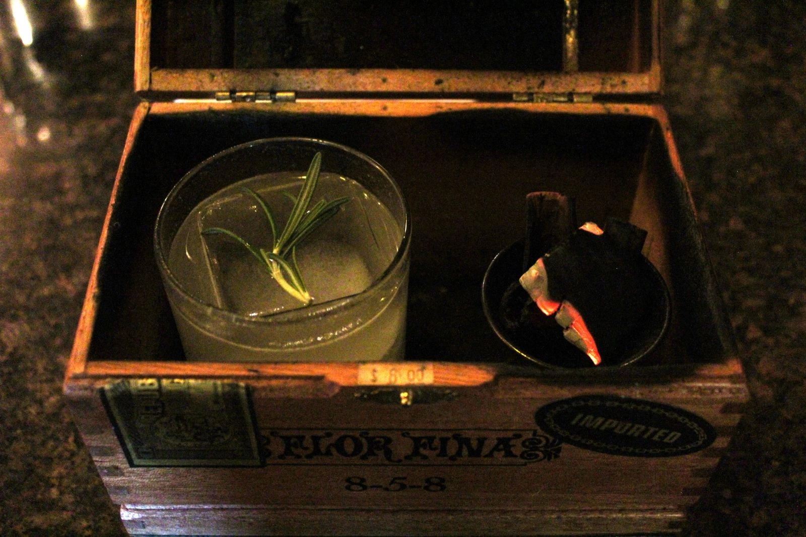 Inside the chest. Drink on the left, cinnamon ember on right.