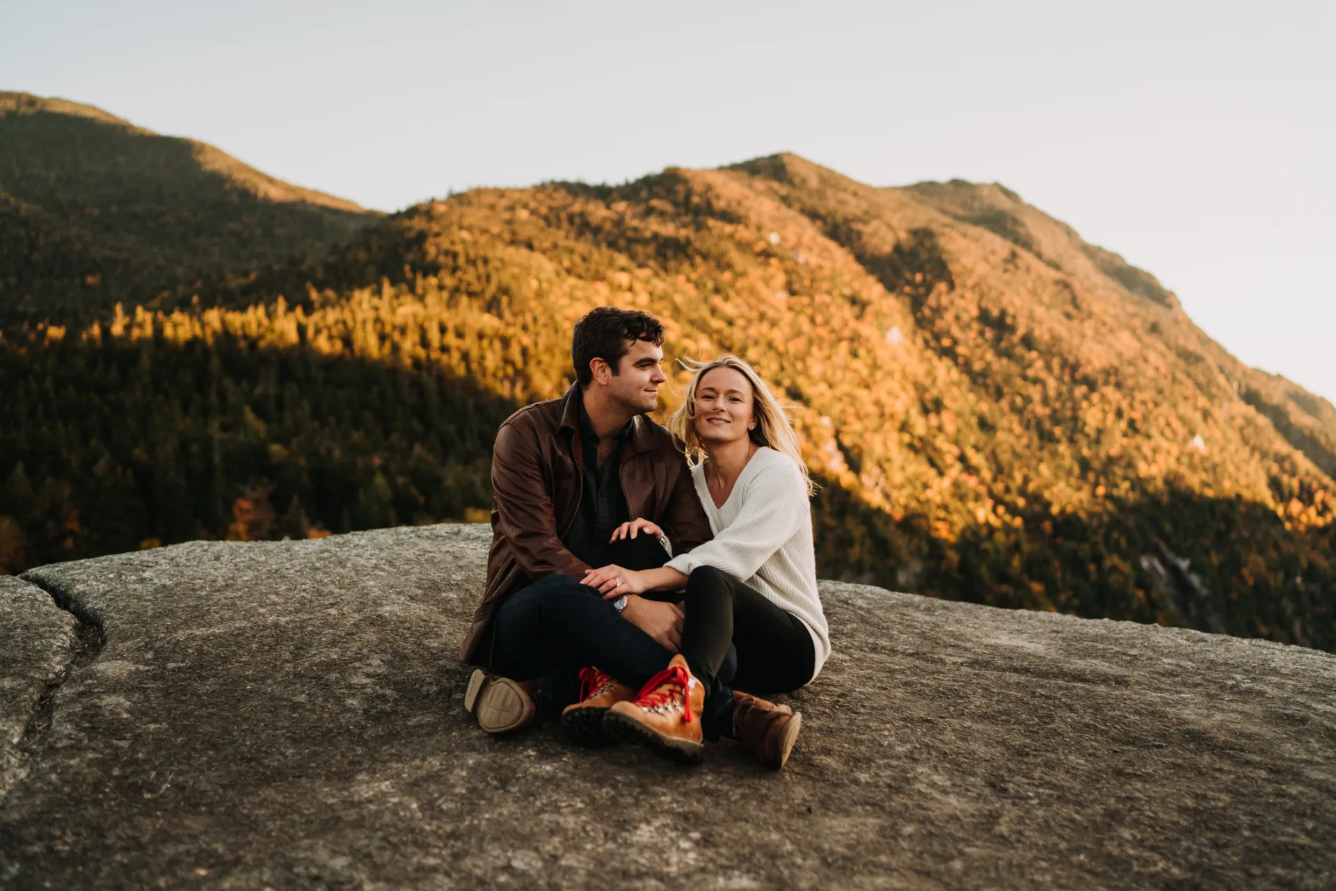 a couple on top of a mountain
