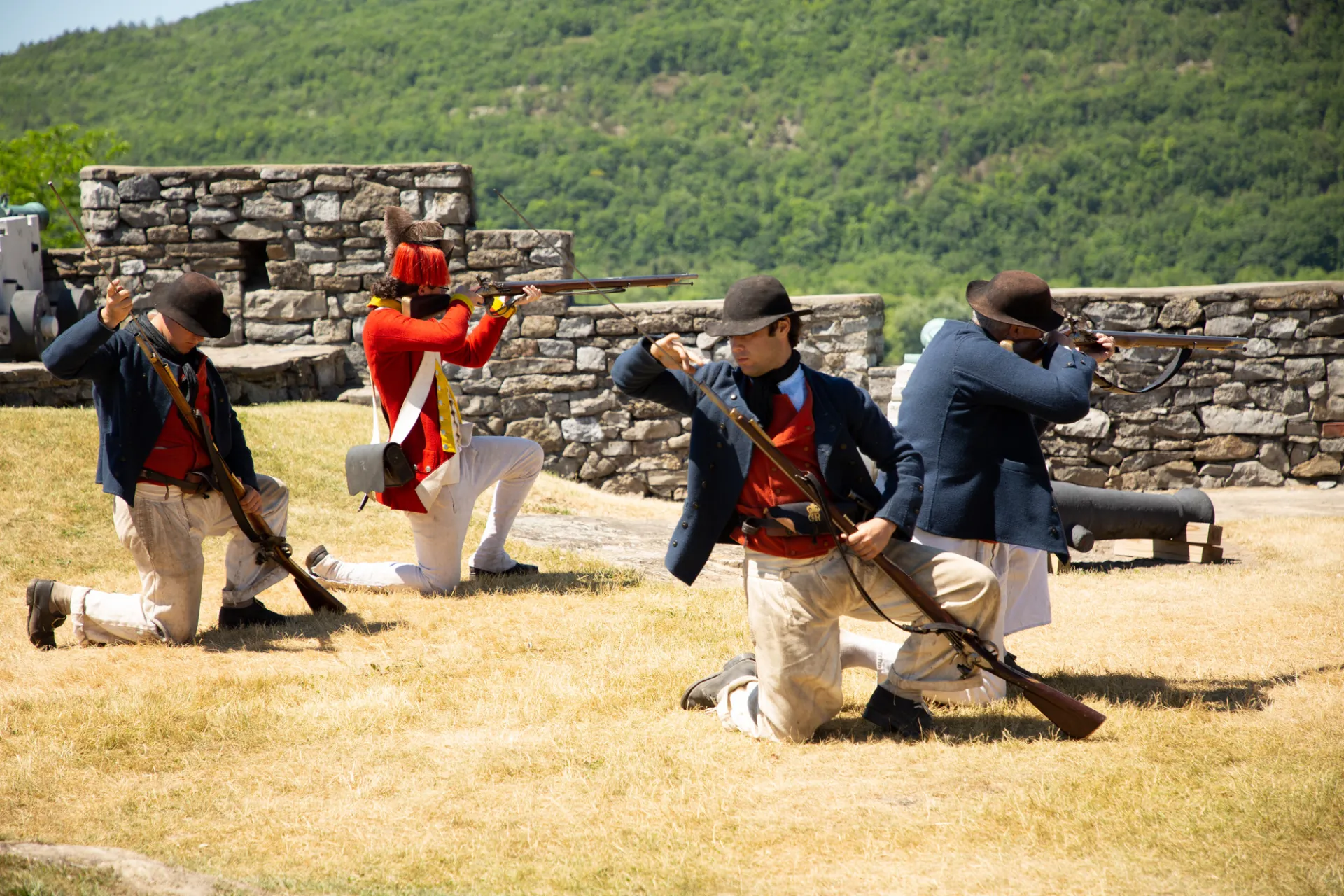 Revolutionary war reenactors firing a cannon