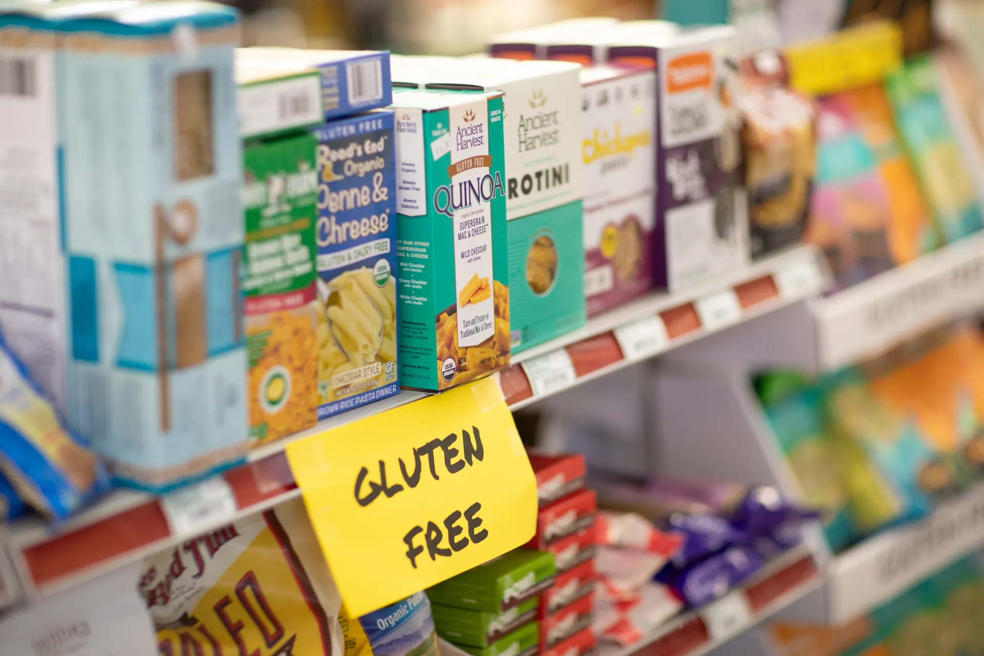 Grocery store shelf stocked with boxes of food
