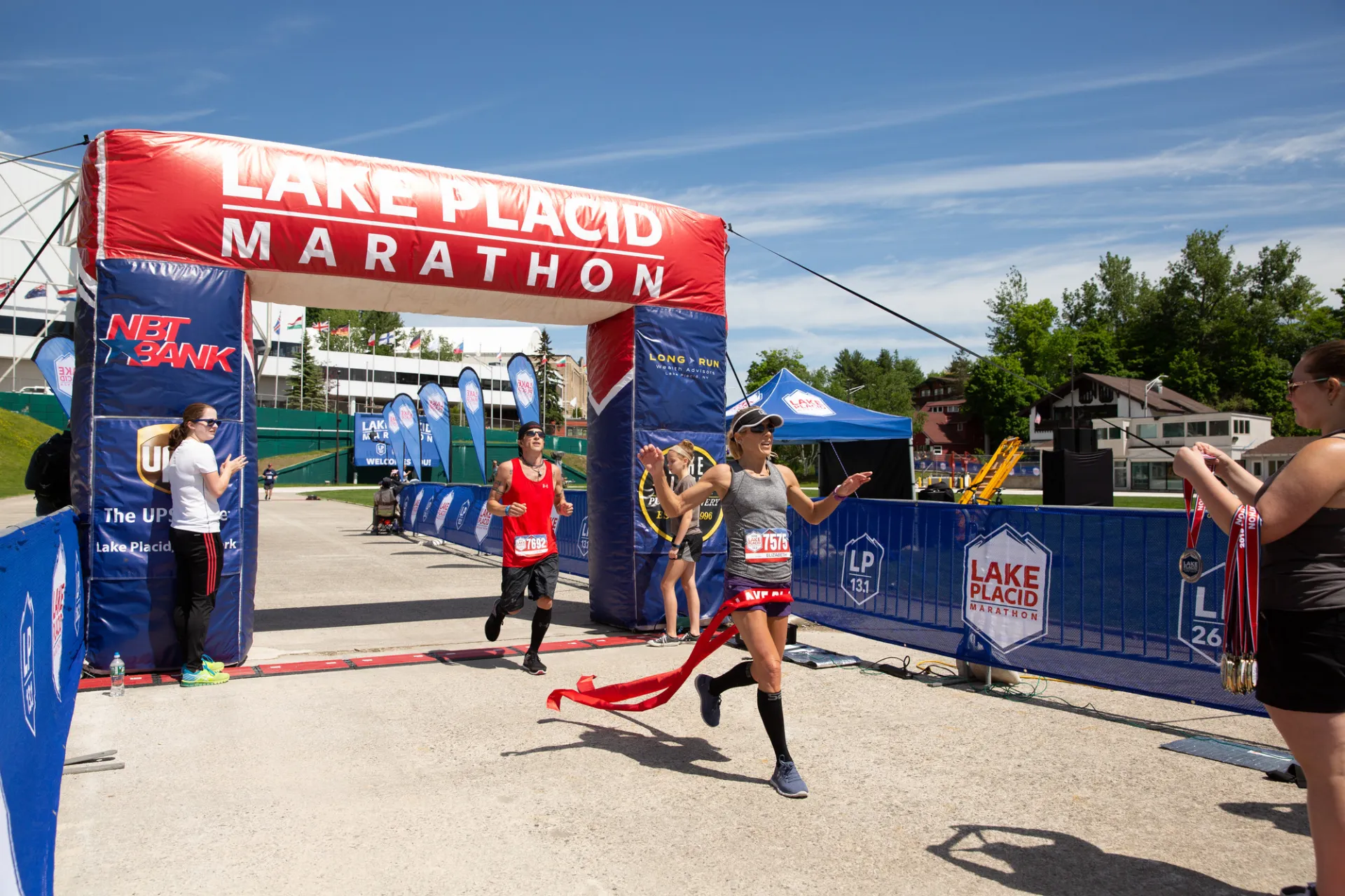 Runner crosses the finish line of the Lake Placid Marathon