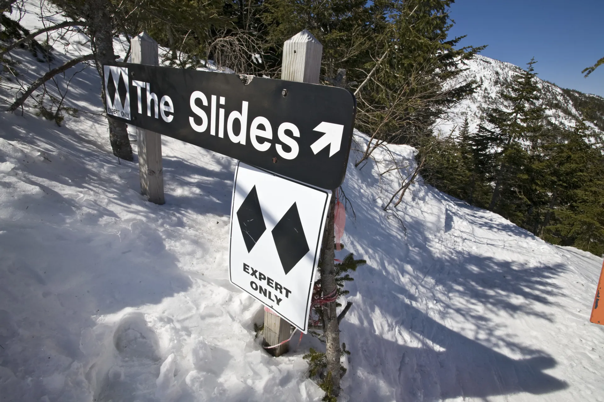 A sign for a double-black ski run.