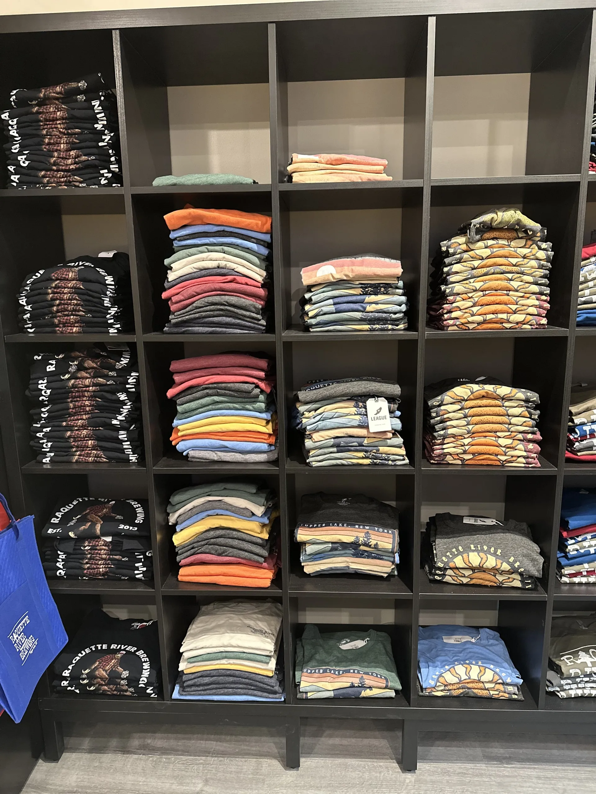 Shelves of branded shirts