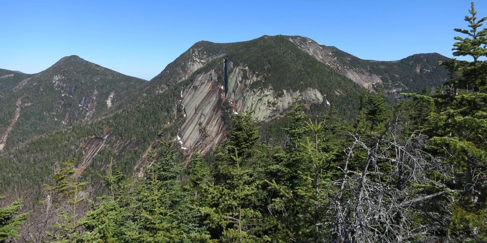 A closer look at Sawteeth's peak from another mountain.
