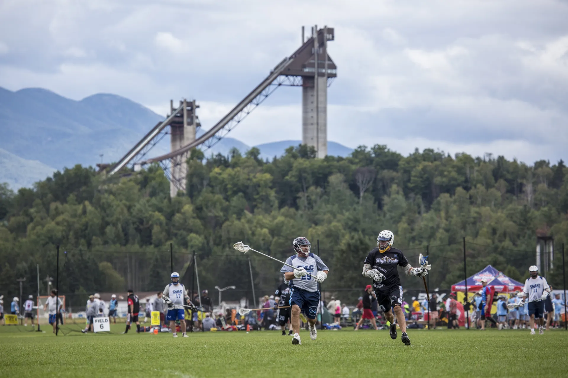 Two men fight for a ball in lacrosse. 
