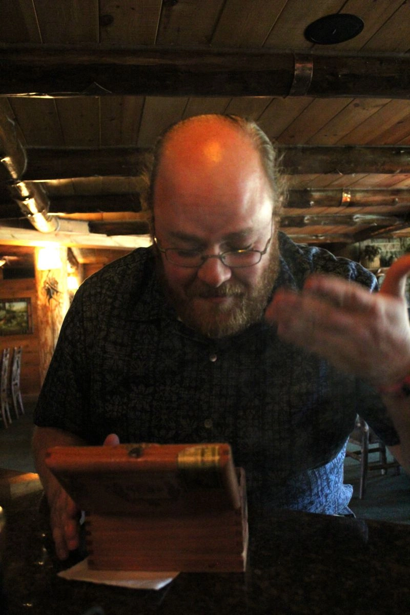 Glenn's pleasantly surprised by the cinnamon smoke wafting from the box.