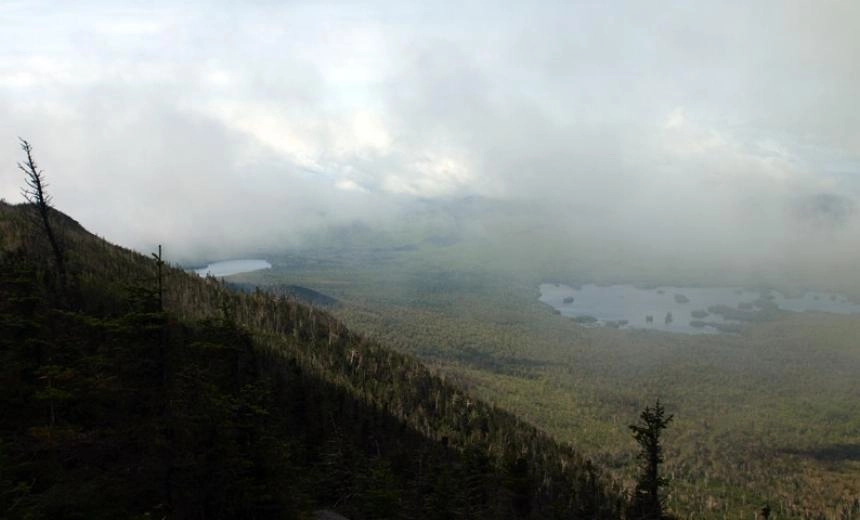 A view of a large lake from high up in the mountains