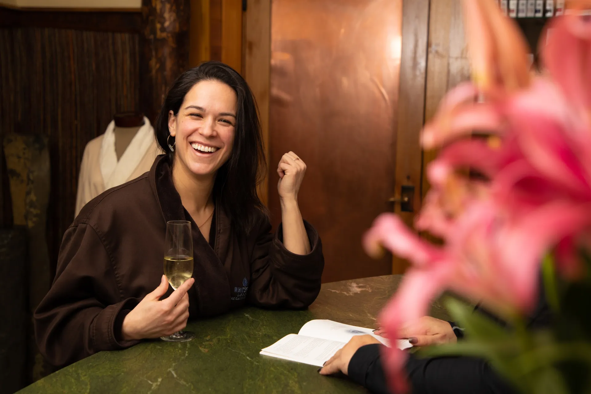 A woman checking in at a spa in Lake Placid.