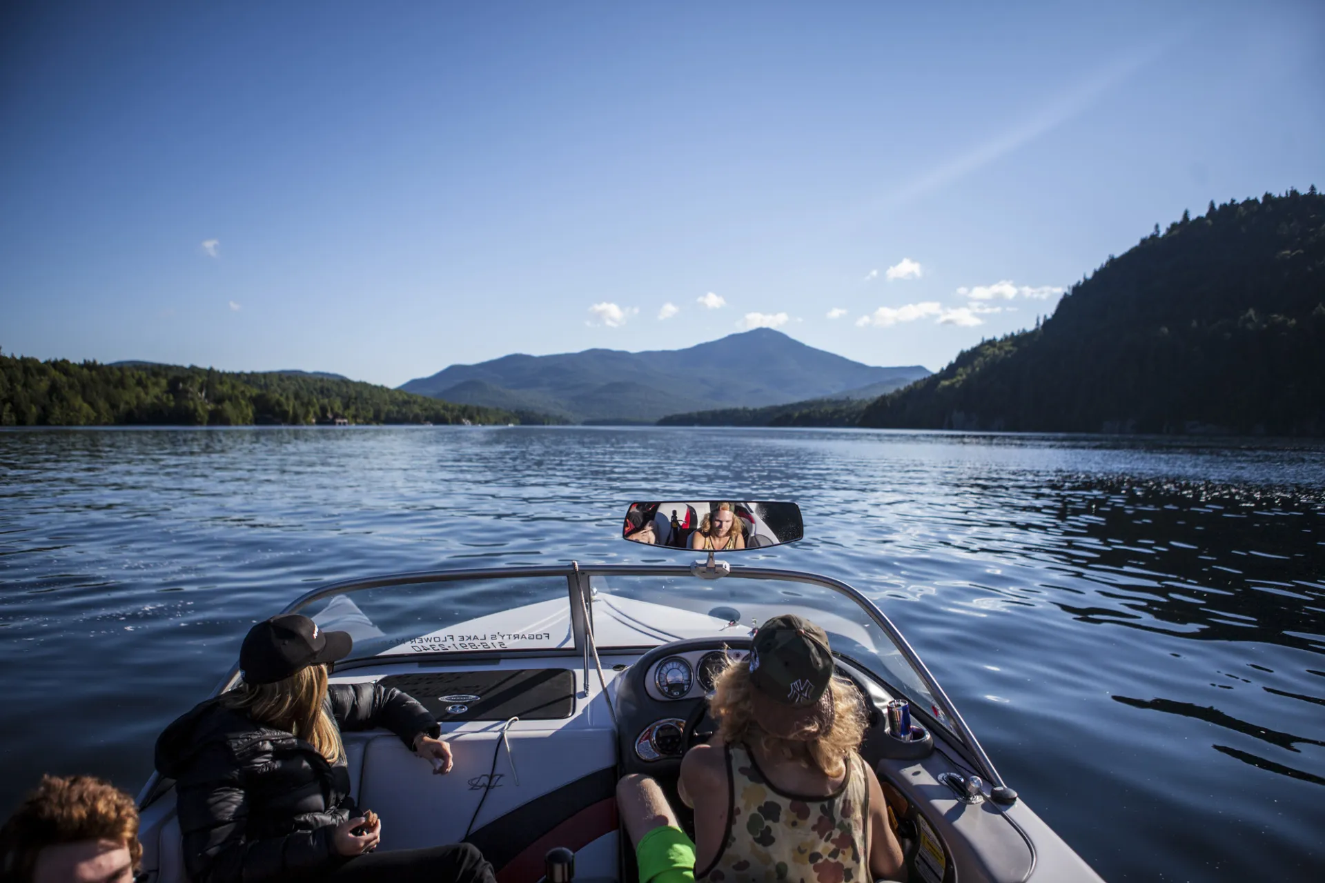 A group of people ride in a boat 