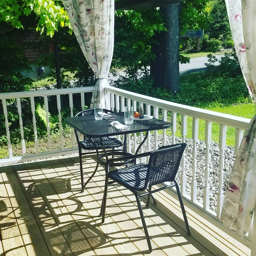 Outdoor bistro seating on the porch.