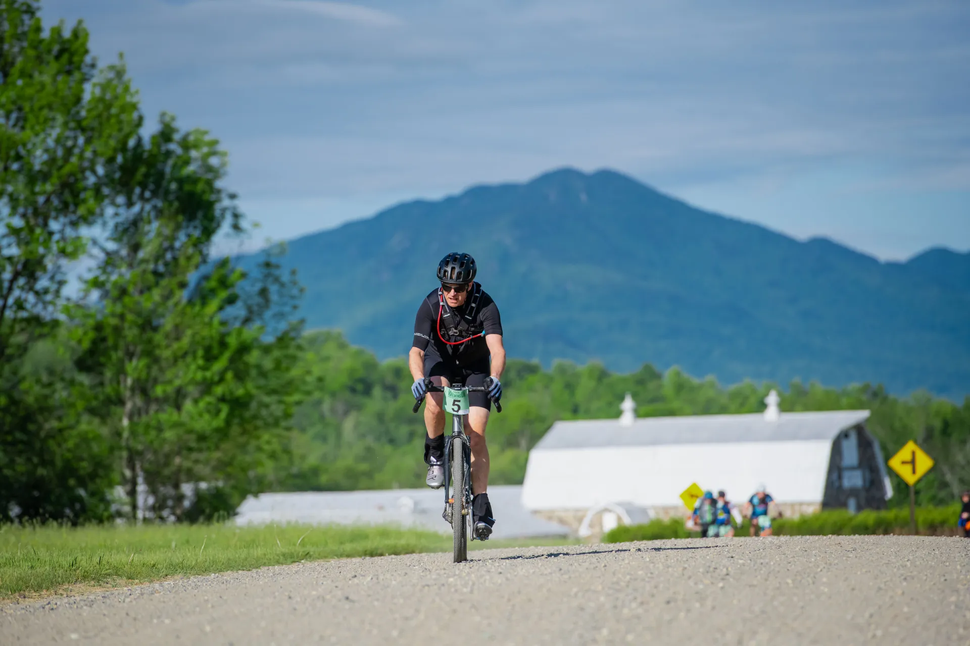 Bike racer on road with mountain in background