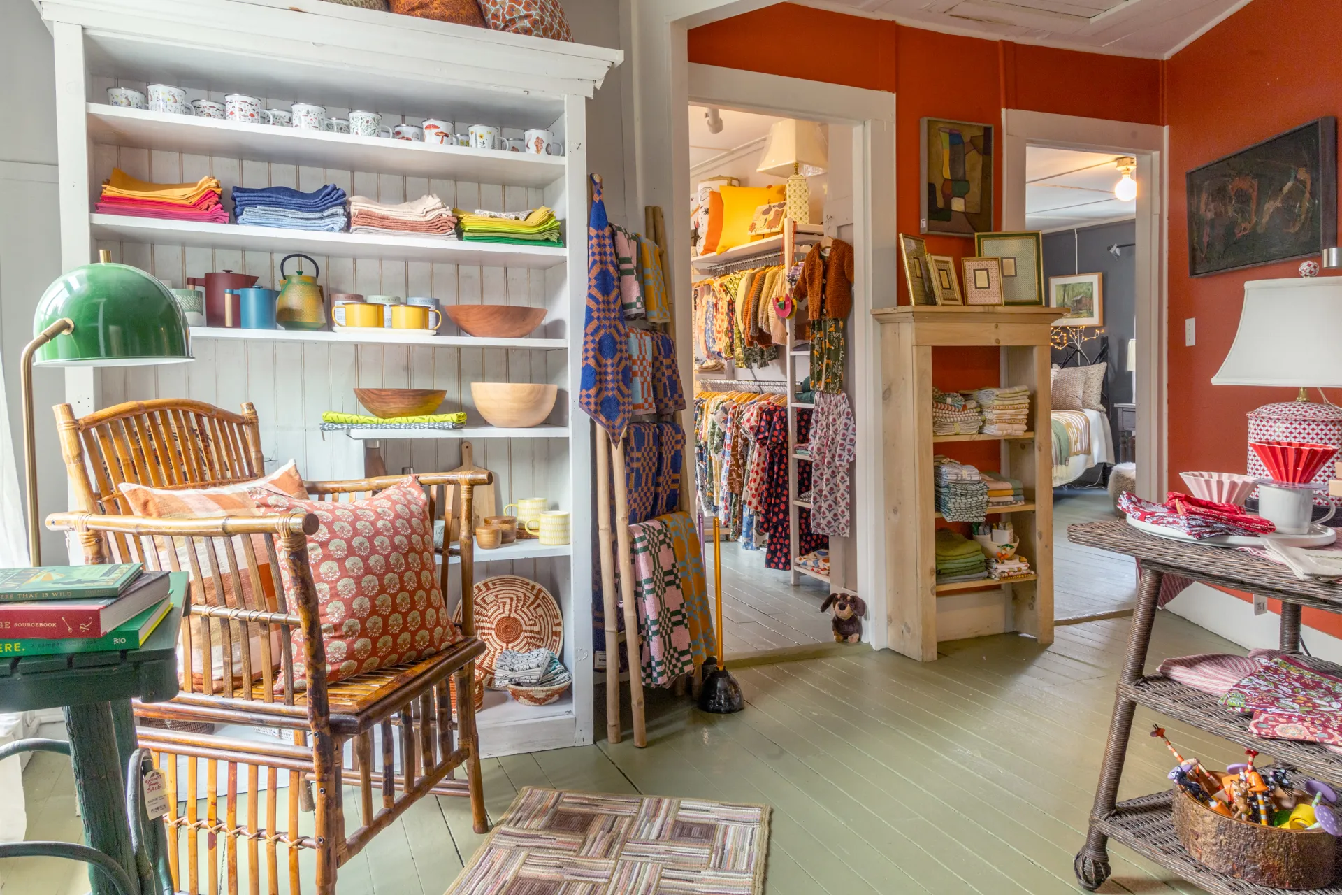 Kitchen decor with hand towels, bowls, butter dishes and cook books.