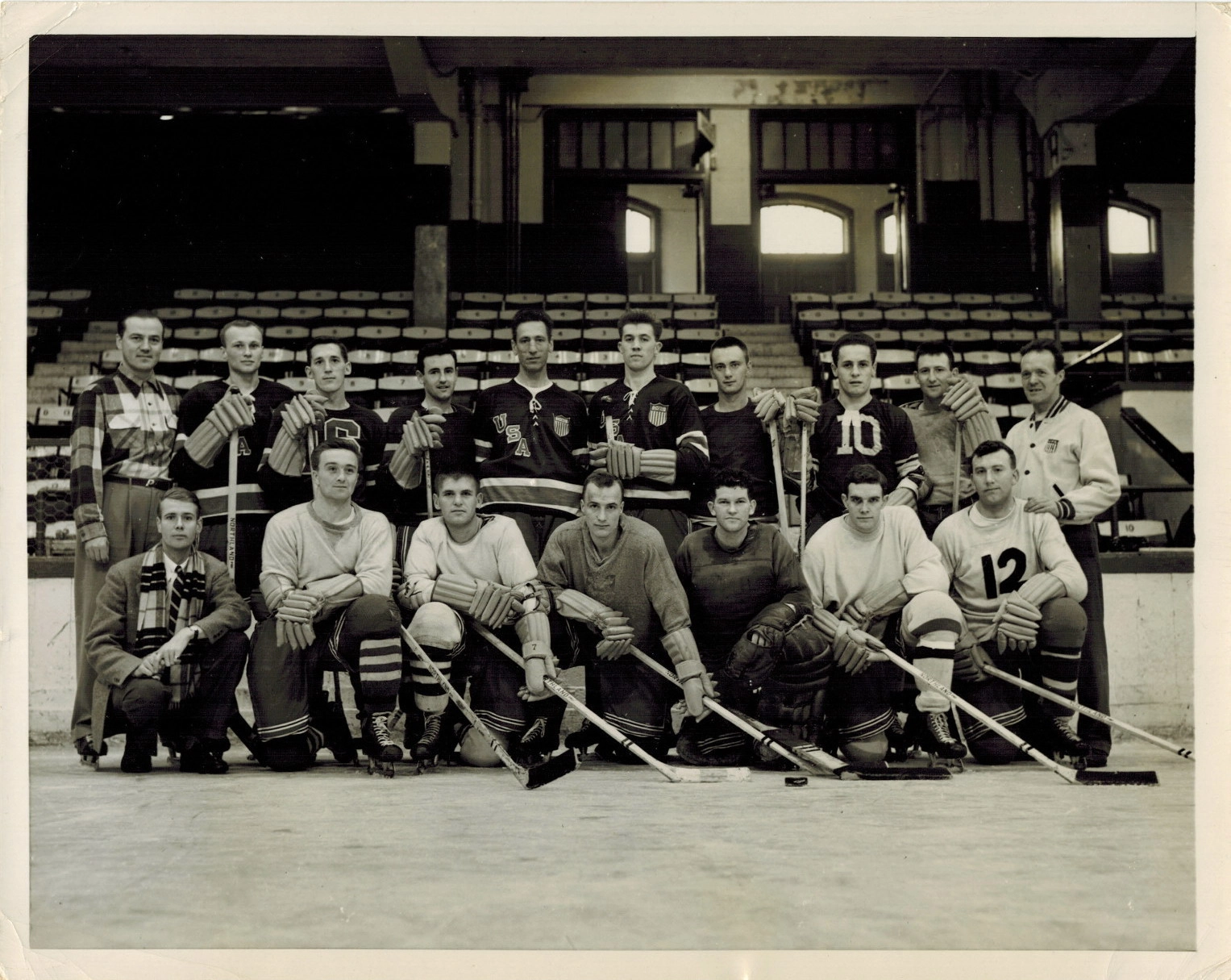 A black and white image of a men's hockey team posing in two rows on a hockey rink. The photo dates from 1952.