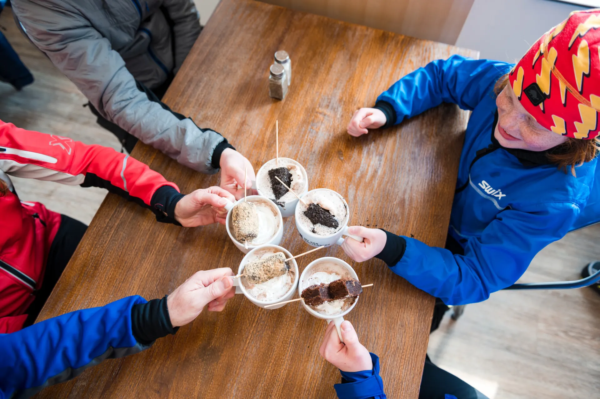 Family cheers with hot cocoa