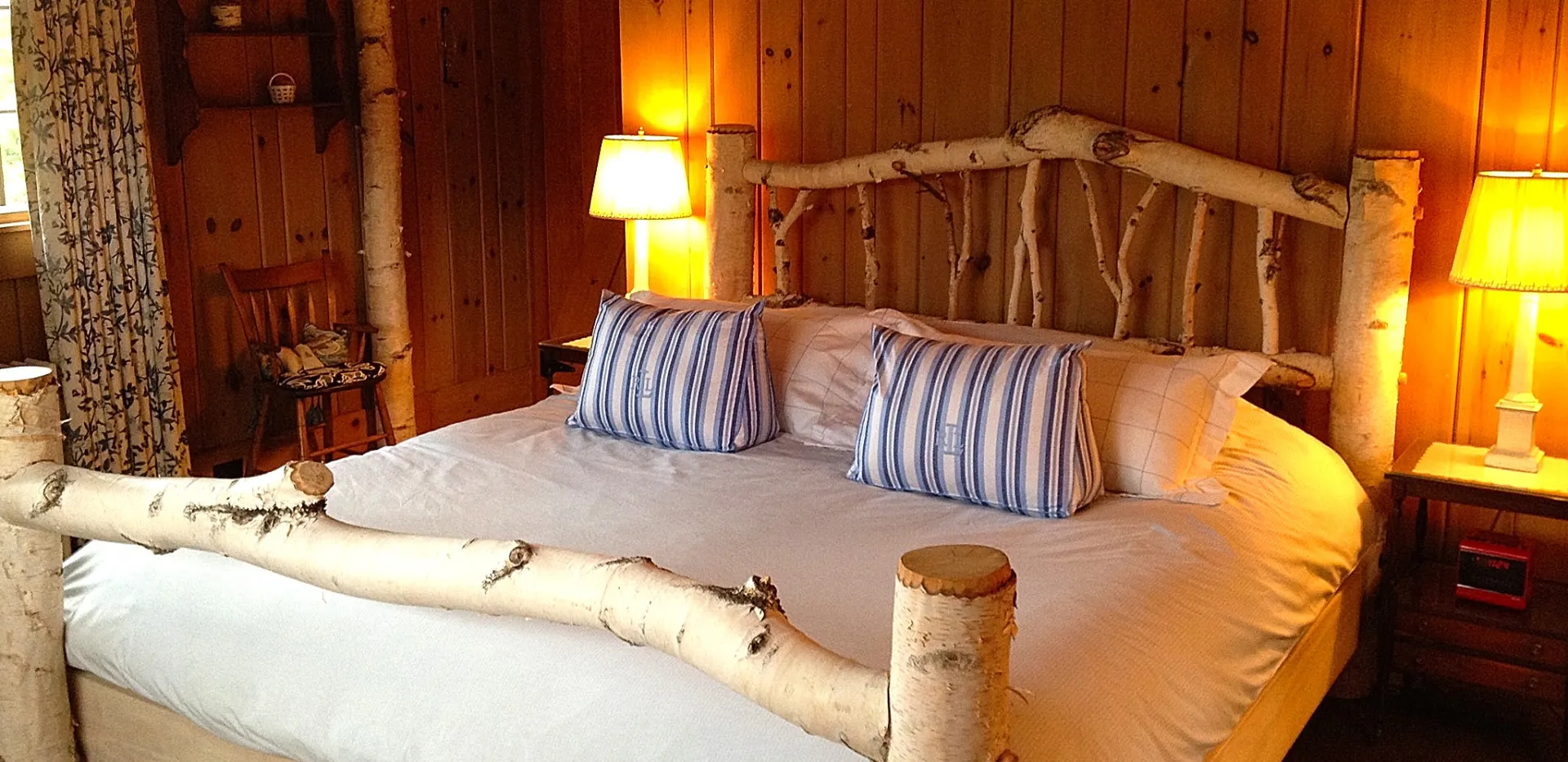 Lush bedding on the birch wood bed.