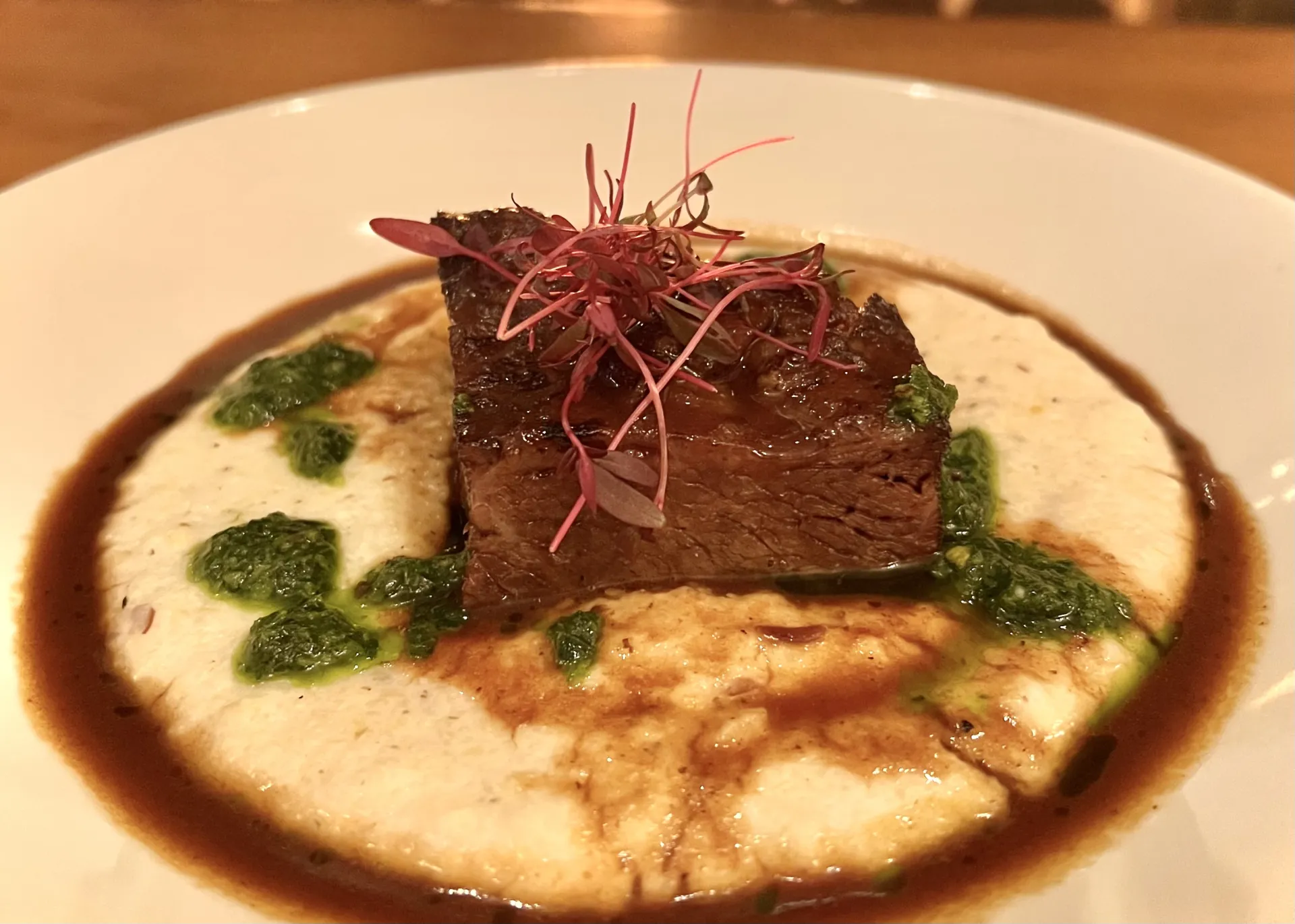 Steak with microgreens.