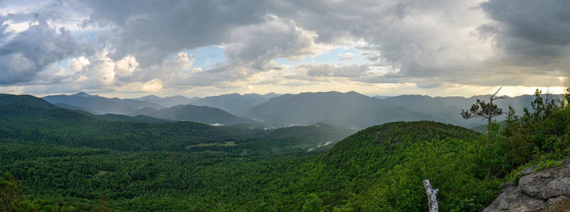 A panoramic view of mountains during sunset