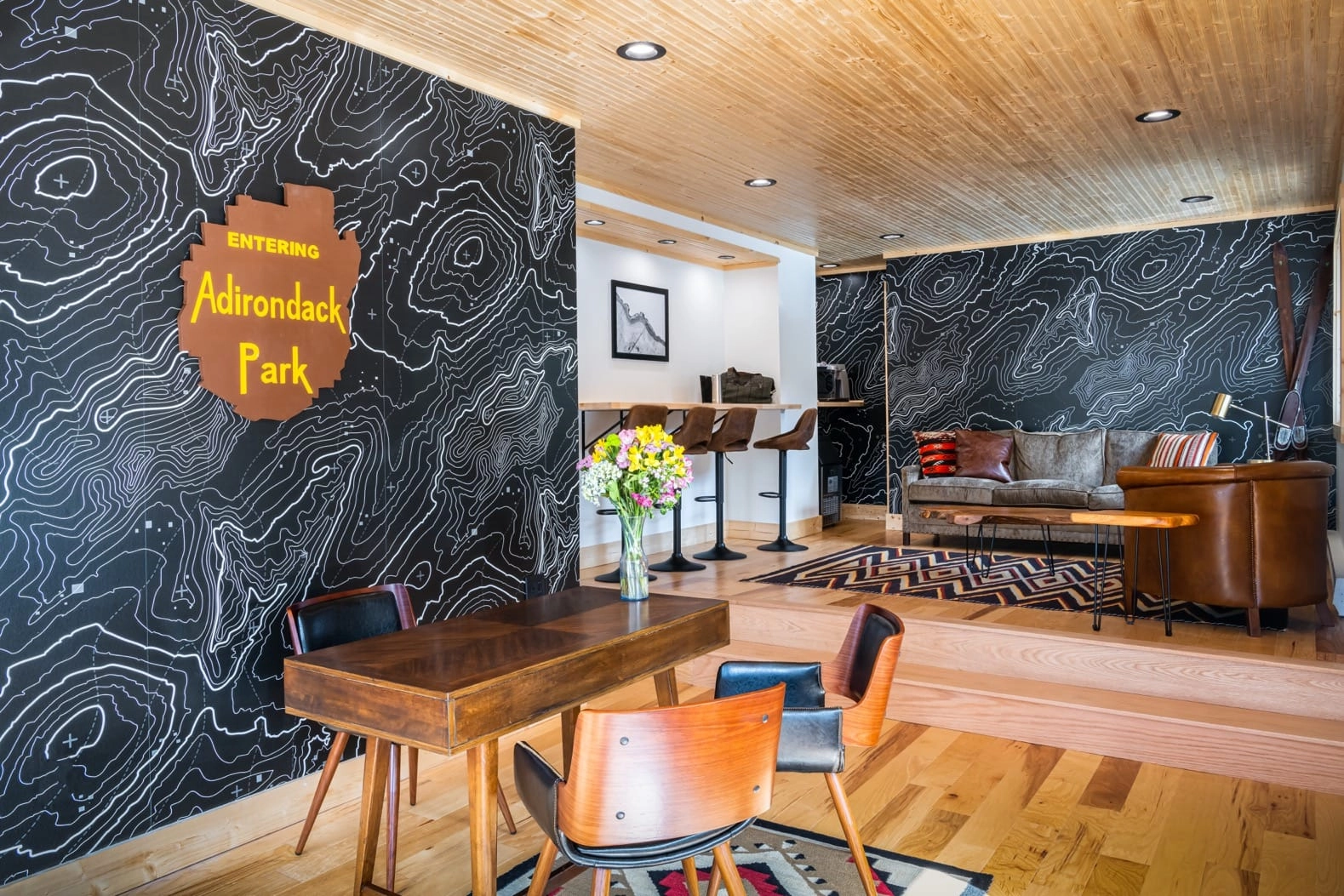 Lobby at Placid Bay Hotel with a replica carving of the adirondack park.