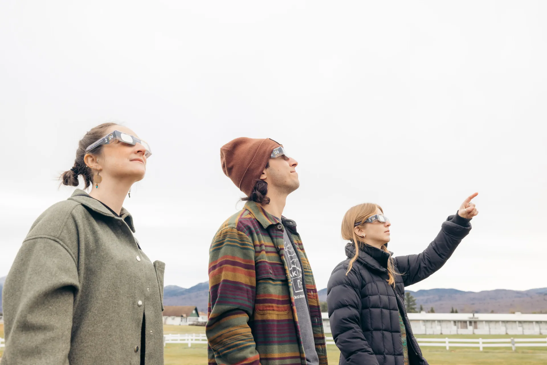 A group of people watching a solar eclipse.