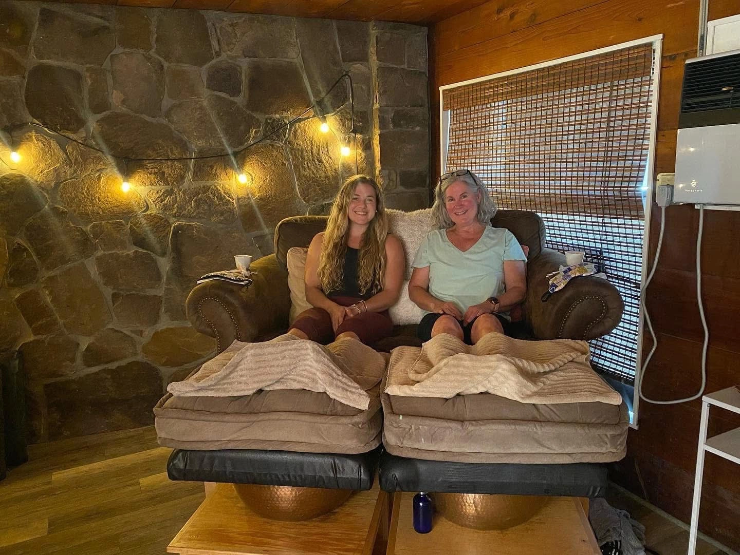 Happy people enjoying the warming pedicure chairs