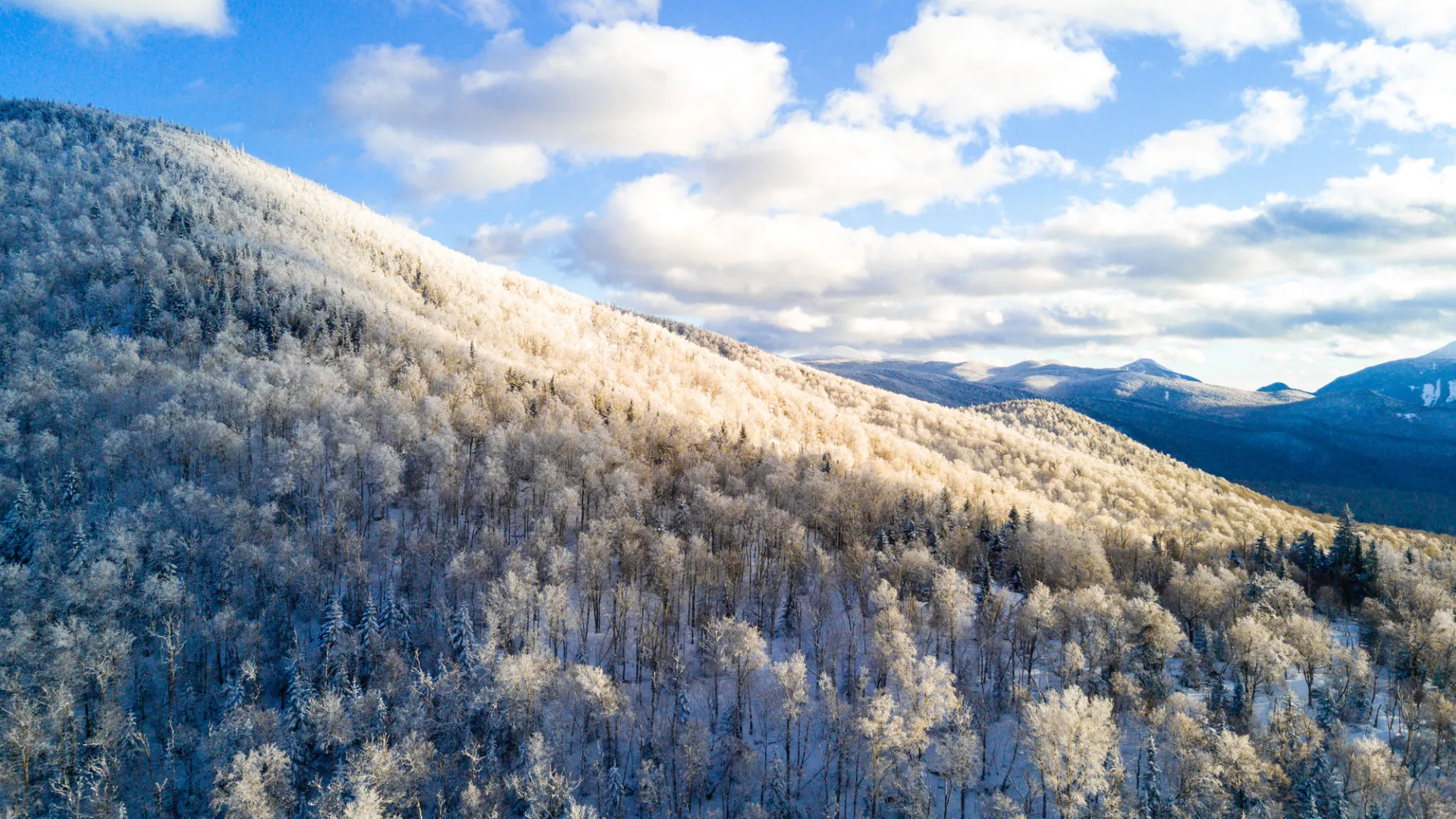 An aerial image of snow-covered mountains