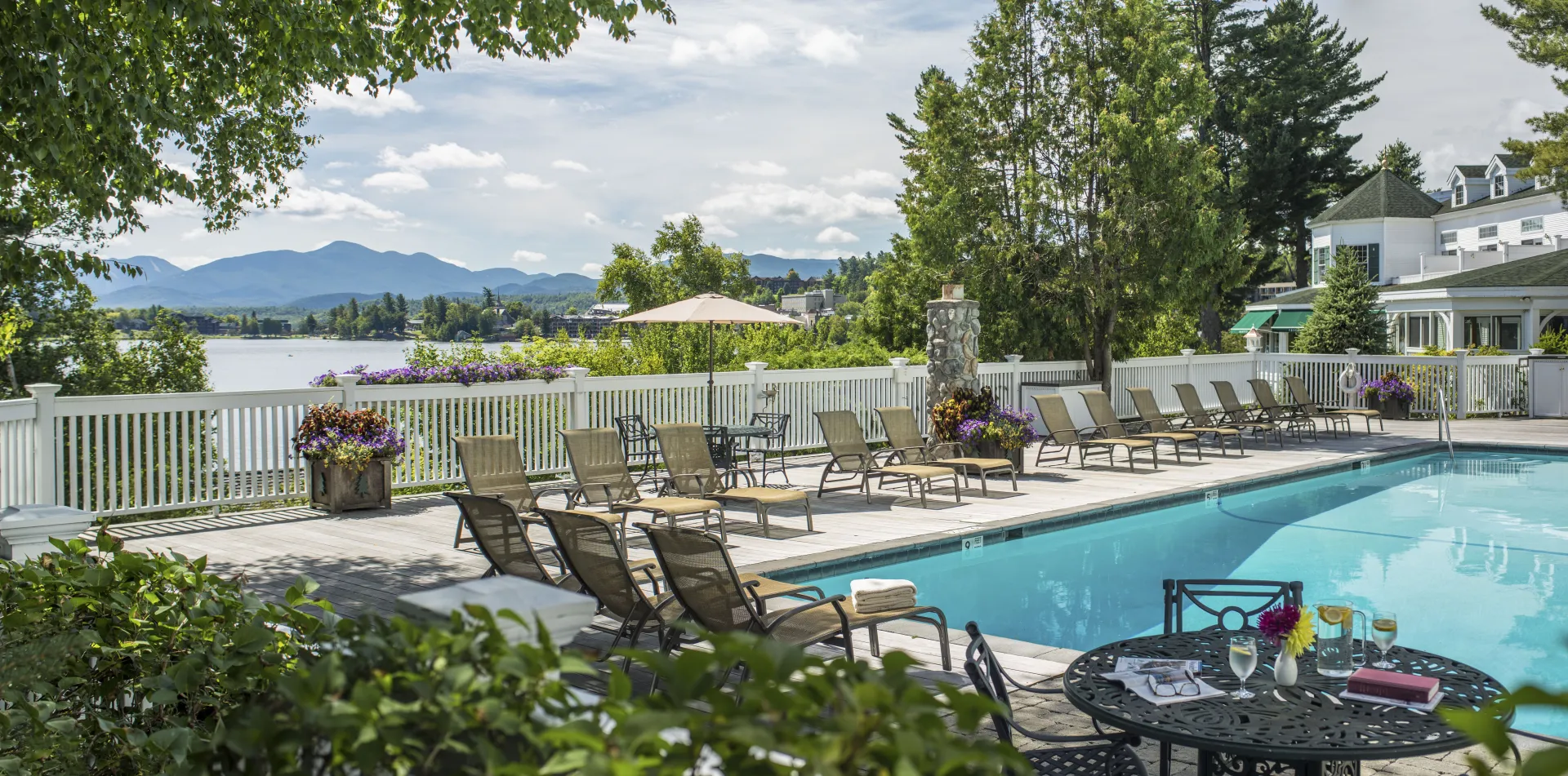 The in ground outdoor pool with the mountains in the distance.