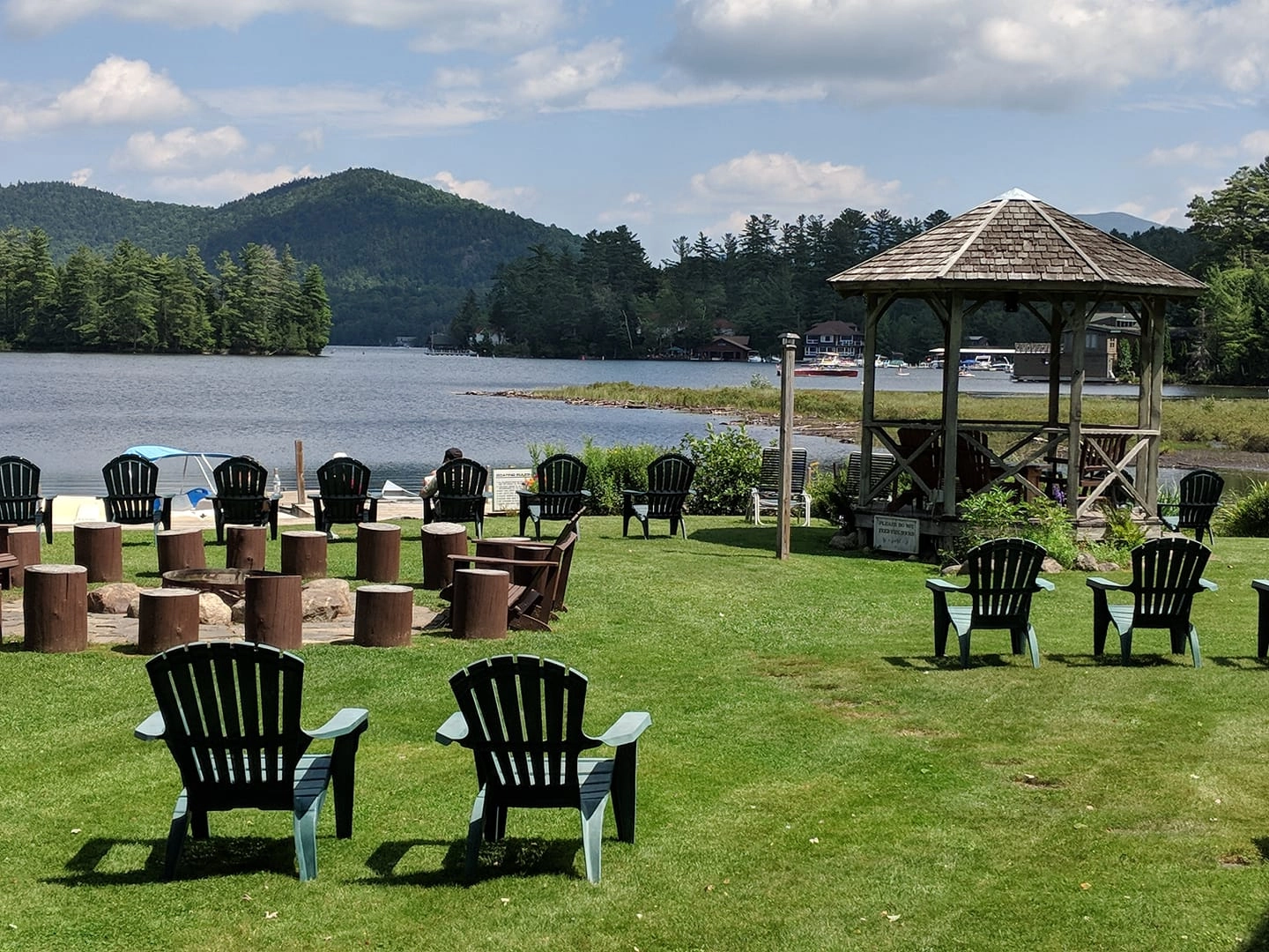 Chairs on the lawn by the lake.