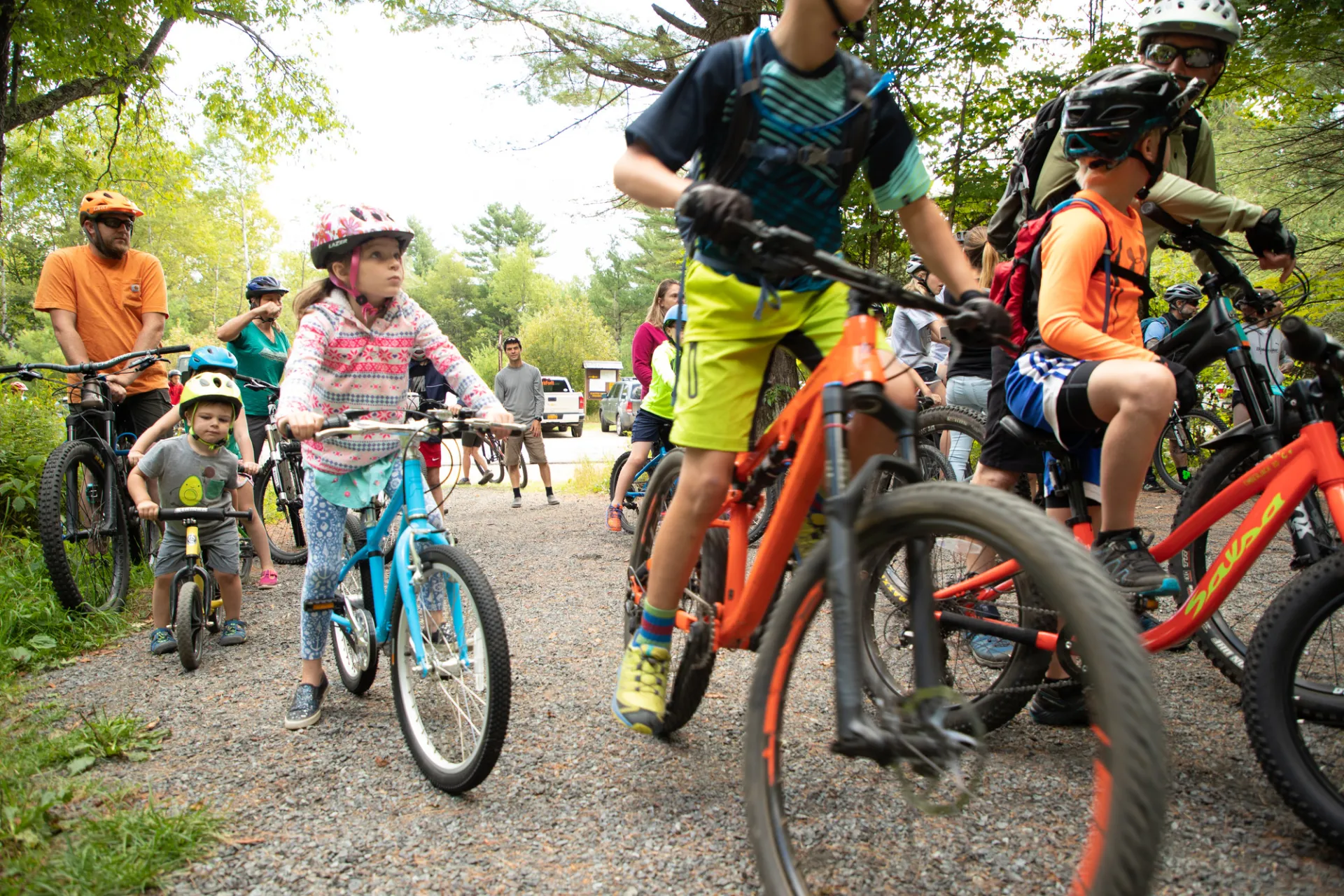 Group of colorful outfits and bikes with participants of all ages