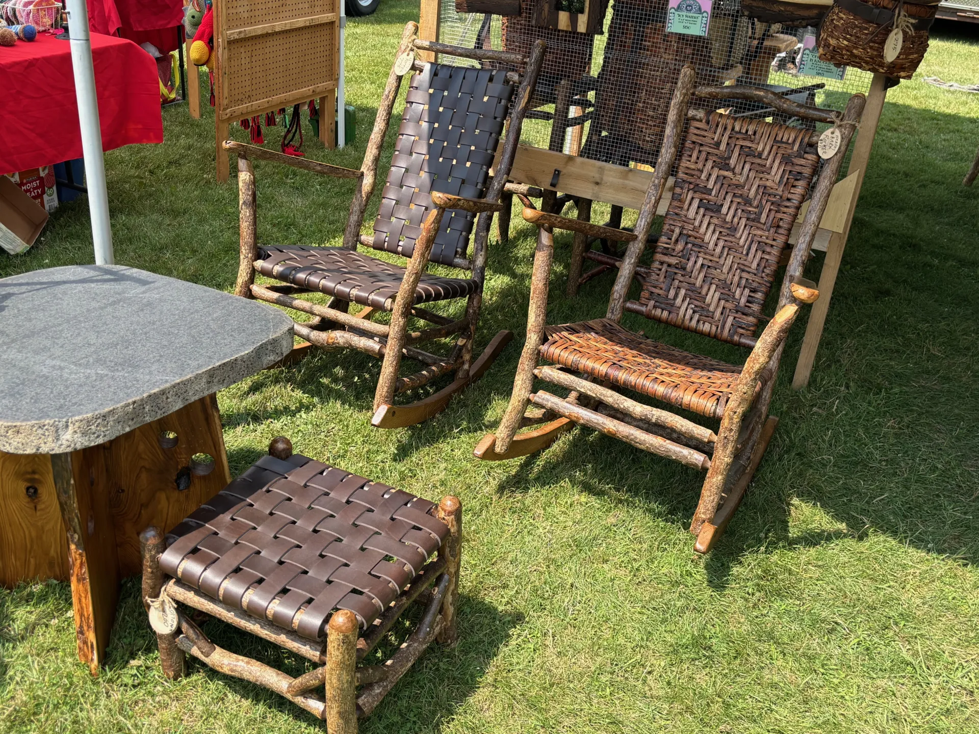 Rocking chairs made with rustic frames and woven bark seats and backs.