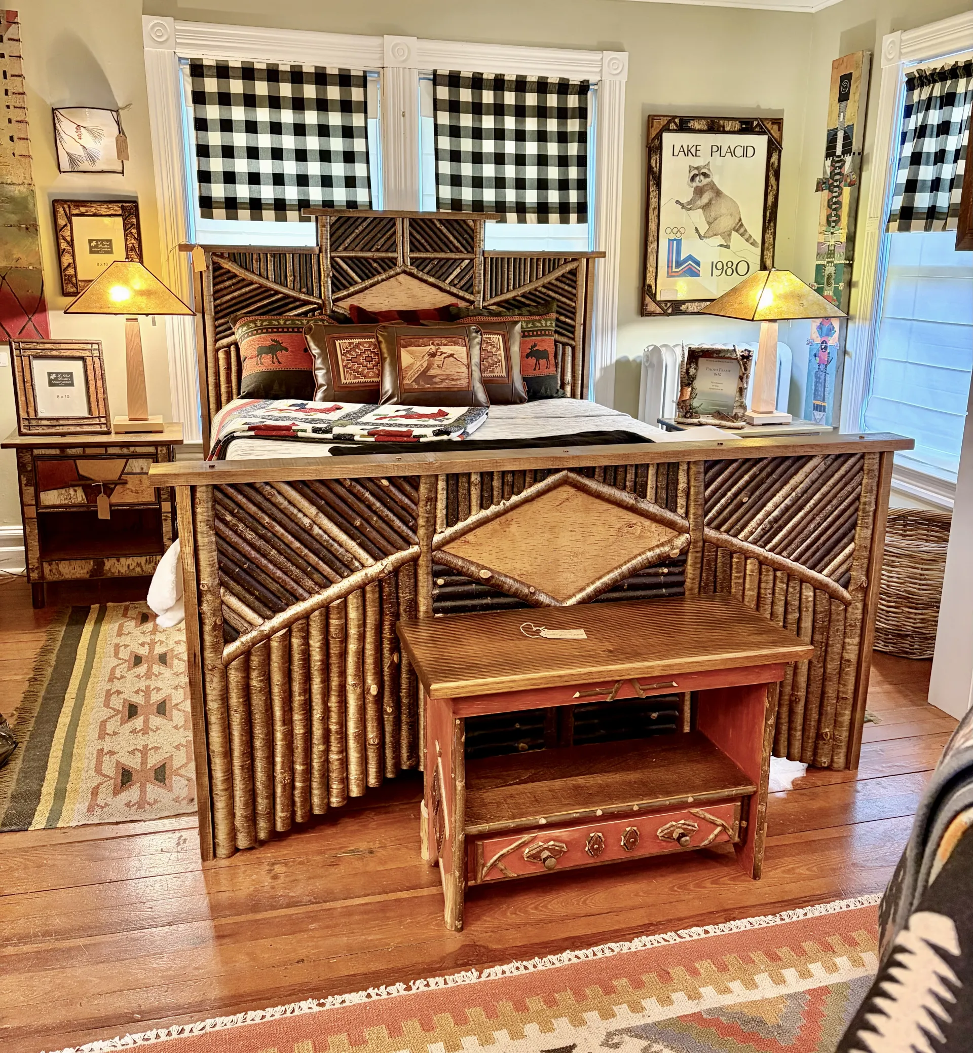A bed frame decorated with sticks cut and arranged into intricate patterns.