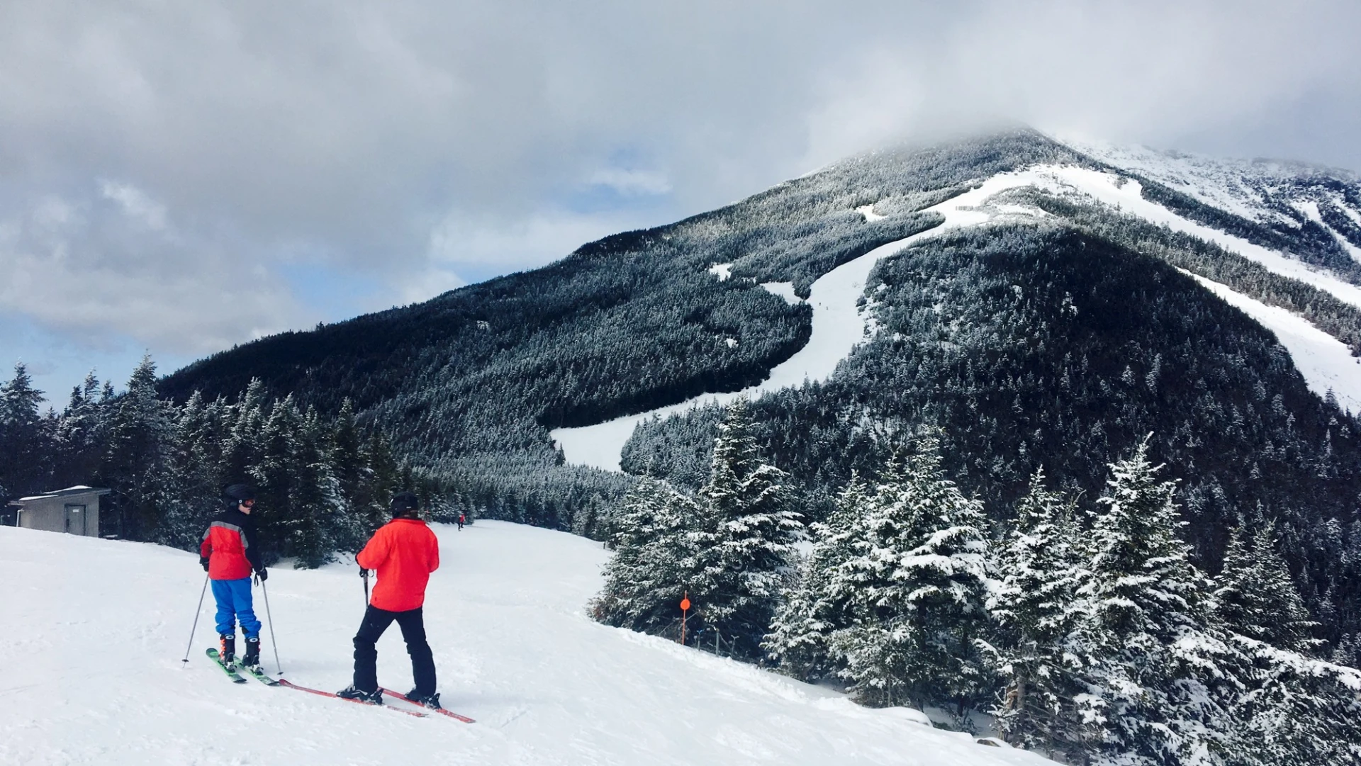 Two skiers on a trail at Whiteface Mountain.