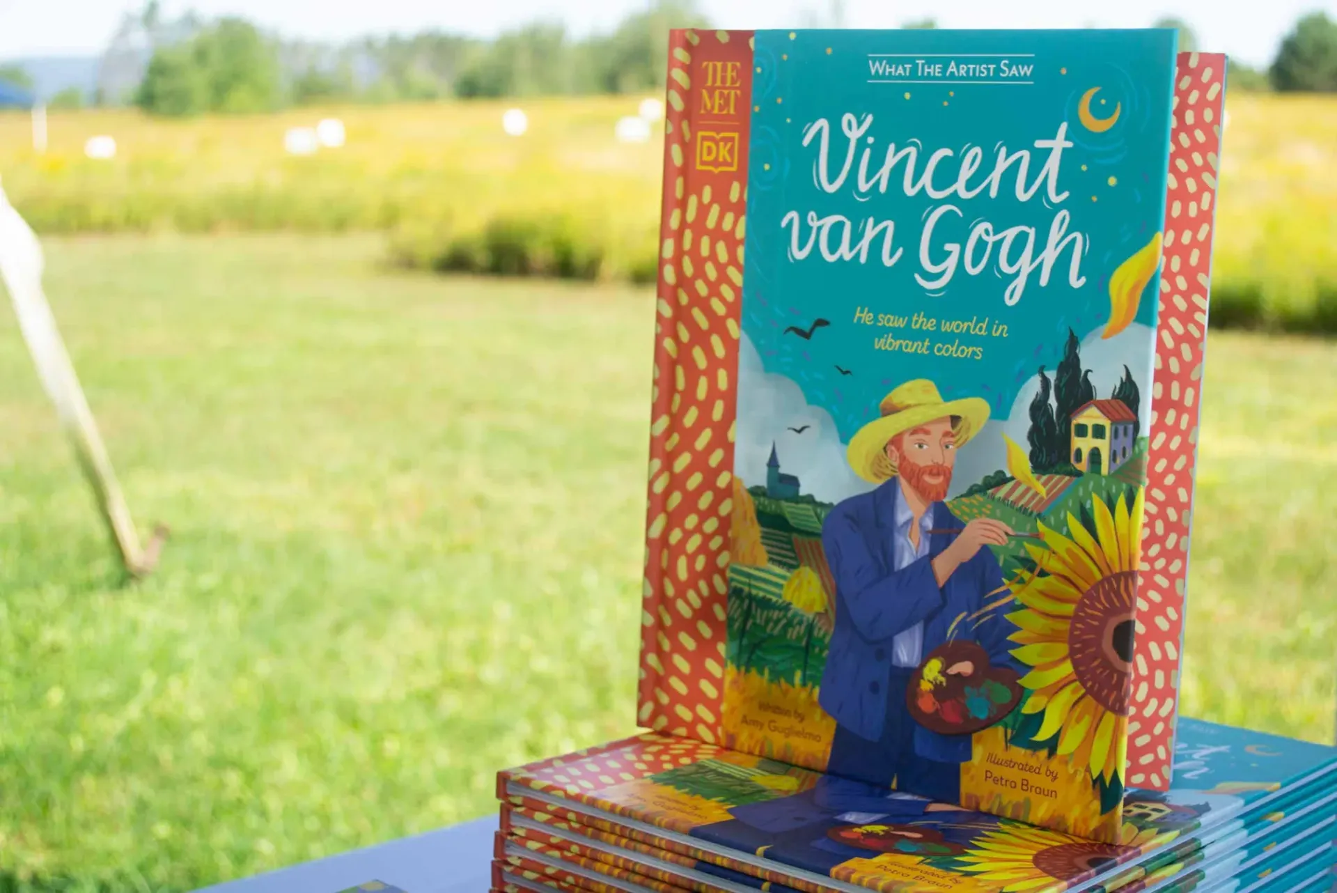 A book about Van Goh on a display stand outside.