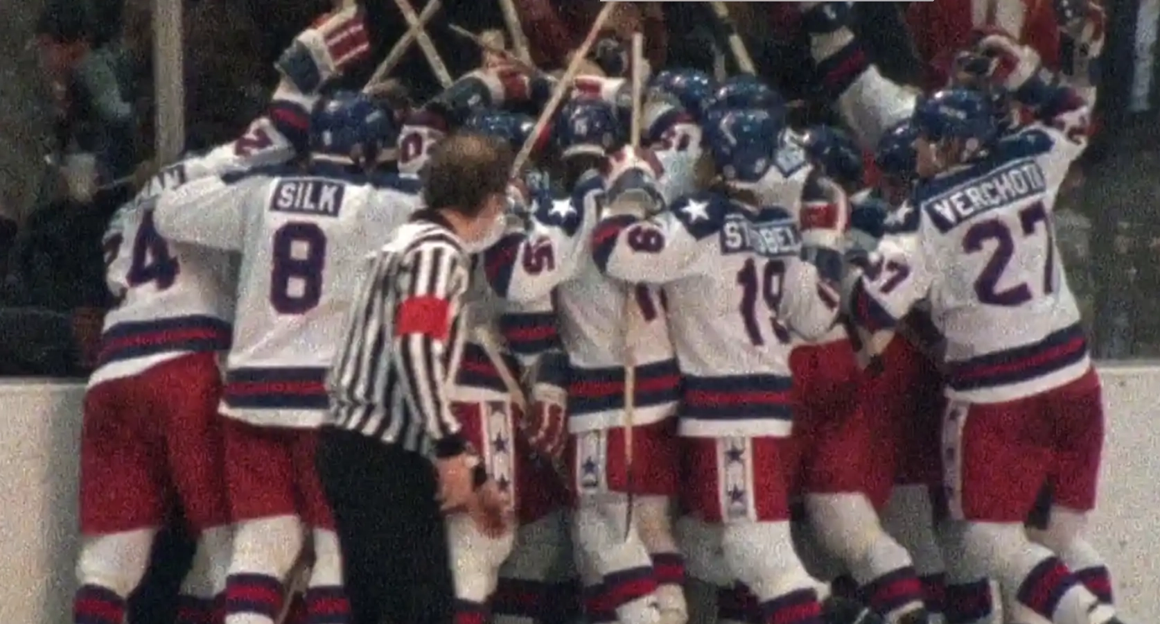 The 1980 Men's USA Hockey team gathered together after victory over the Soviet Union.
