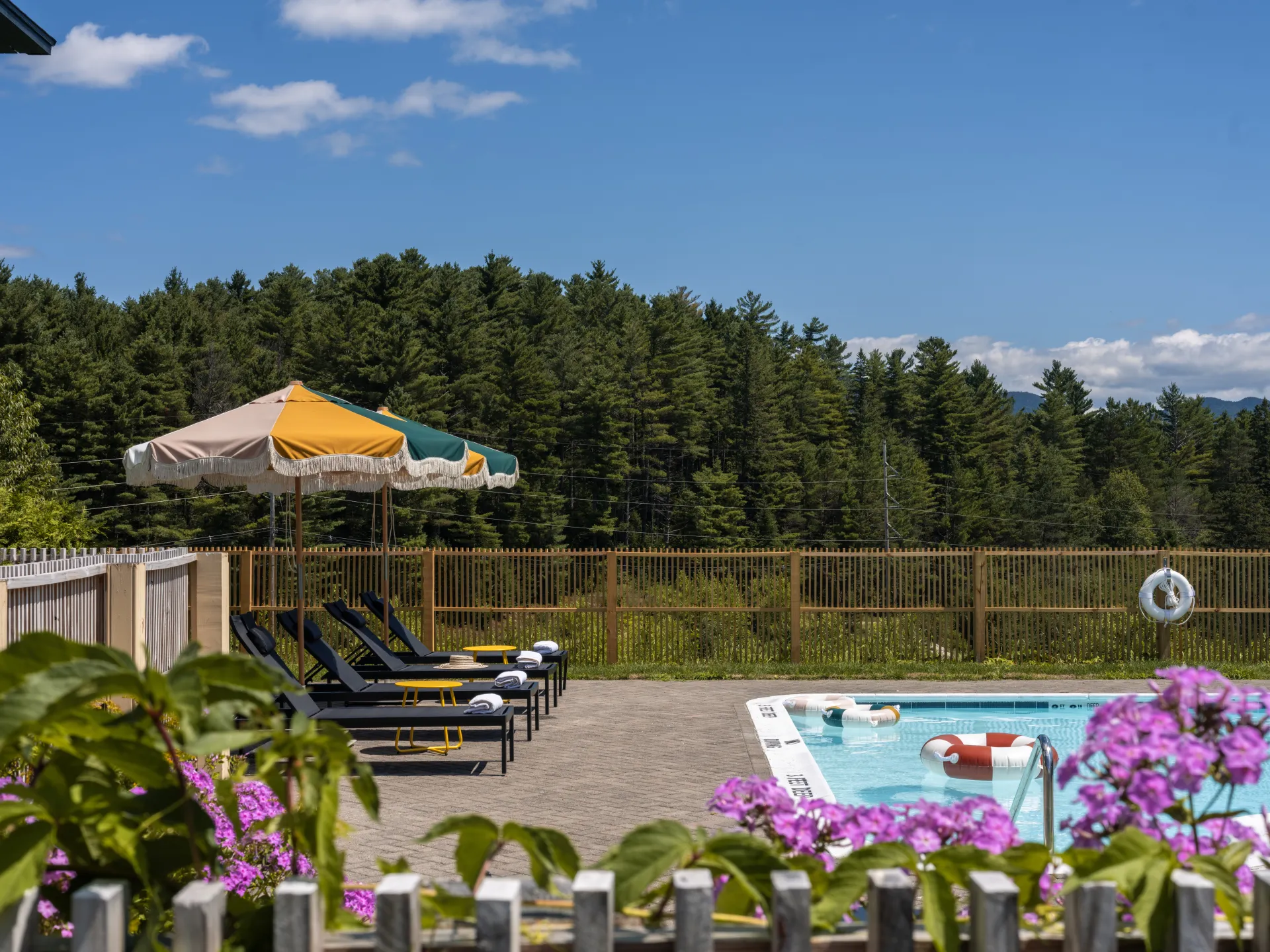A luxurious outdoor pool with views of mountains