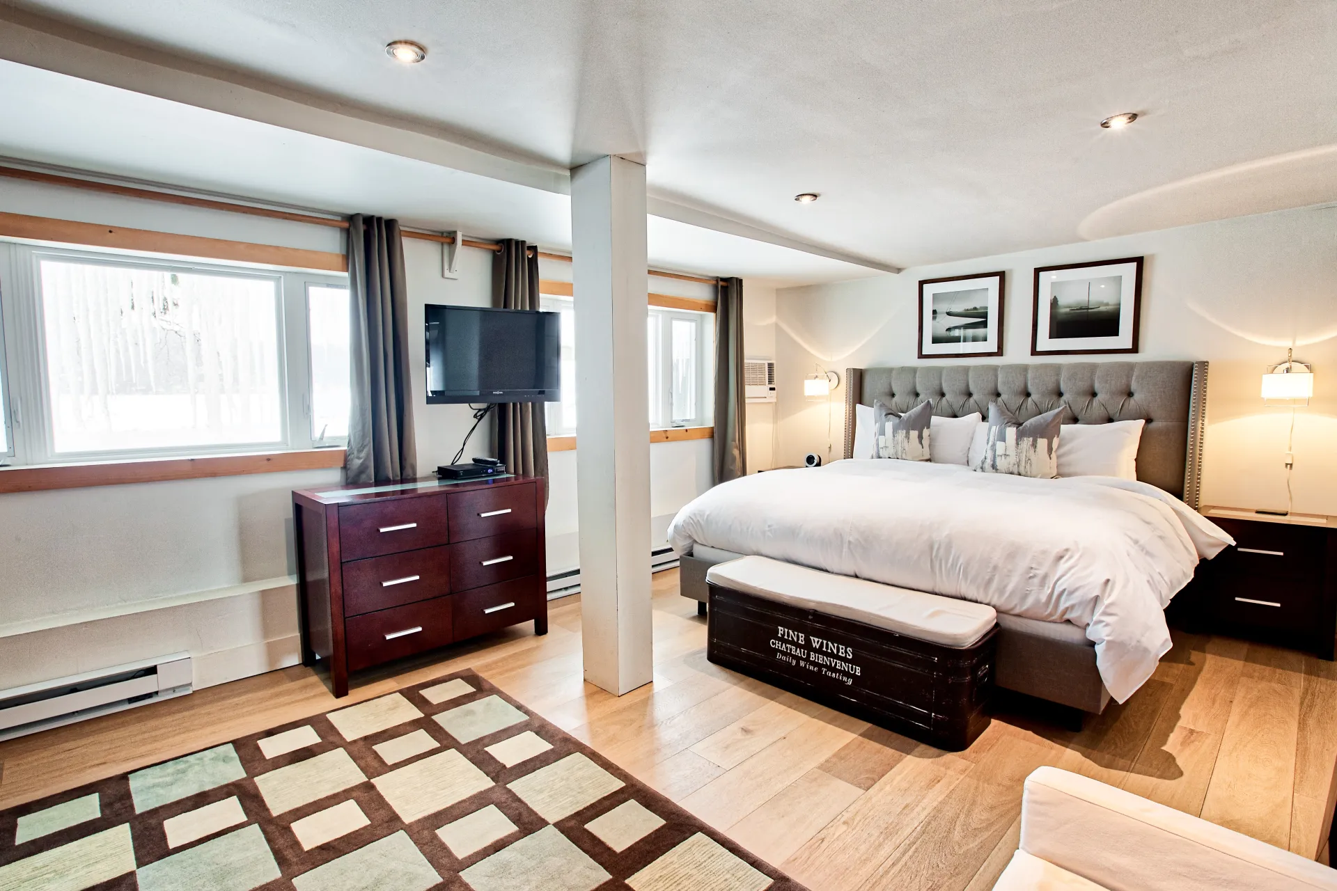 A lush, well appointed bed with dark accents.