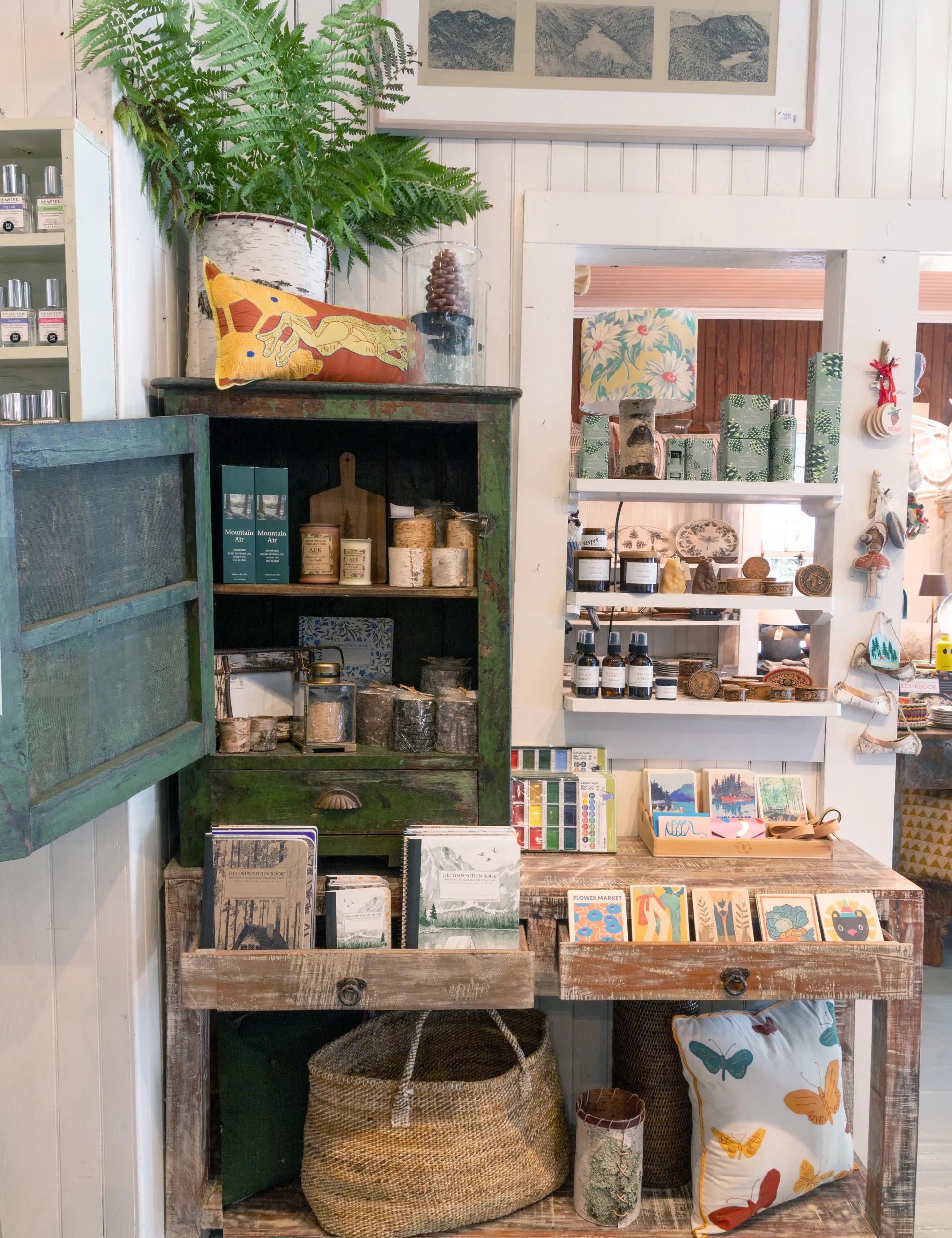 Greeting cards, notebooks, candles and room sprays on display by the counter