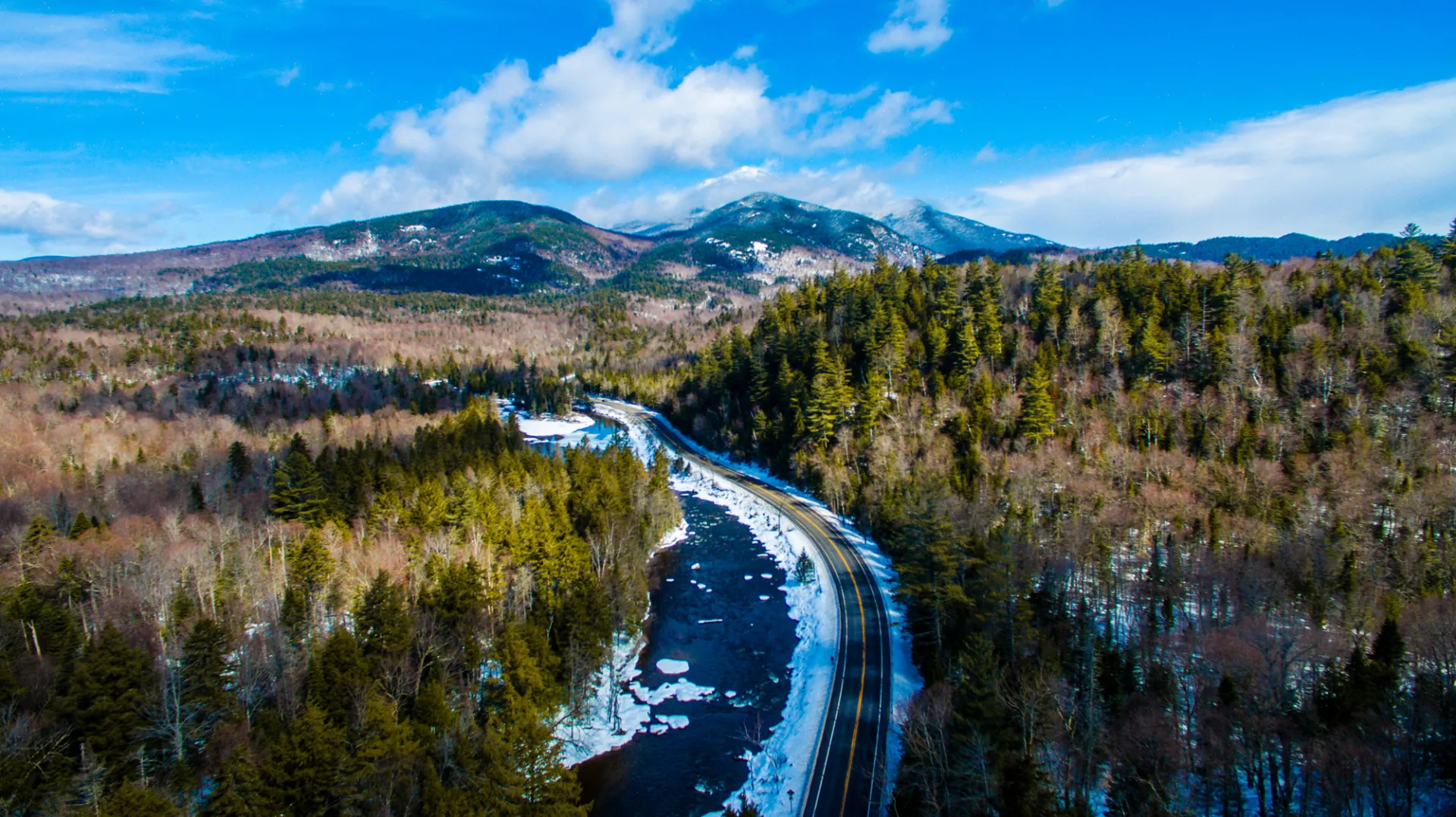 An aerial view of a winding road during the spring.