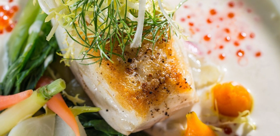 Perfectly cooked halibut garnished with fresh dill