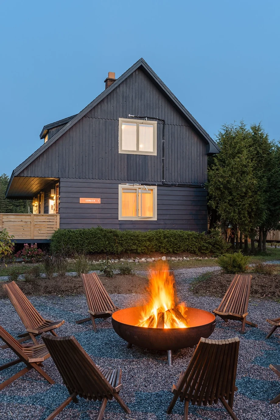A roaring fire in a community fire pit at Eastwind Lake Placid