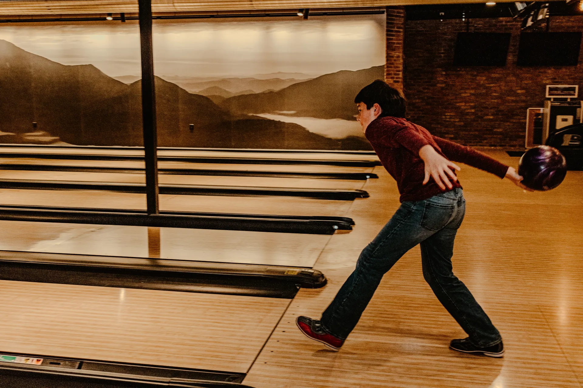 Young man bowling.  Photo Credit to A. Kelly.