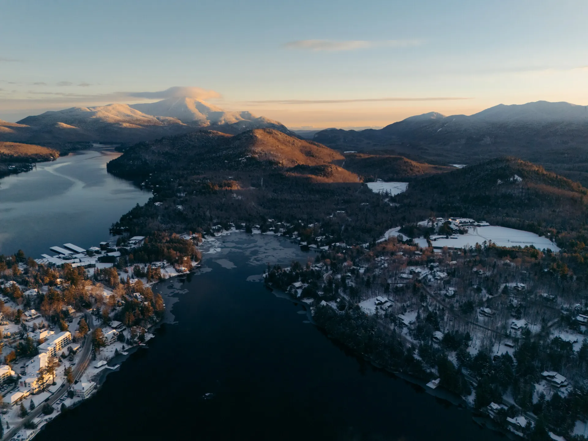 A snowy drone view of Lake Placid.
