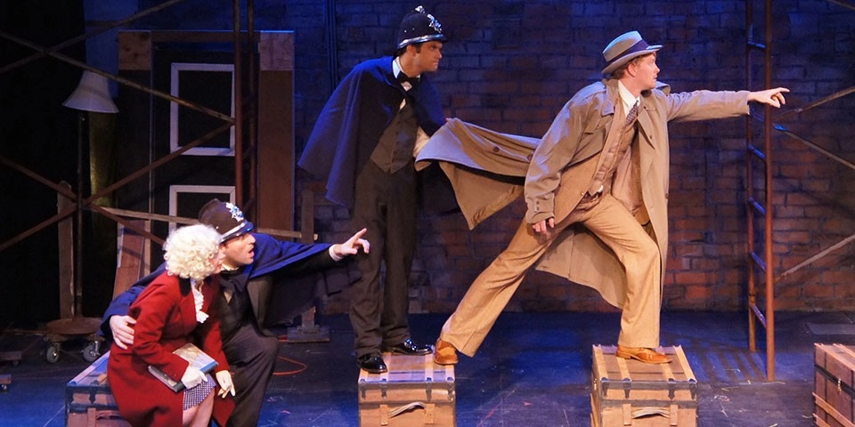 People performing a play on a stage