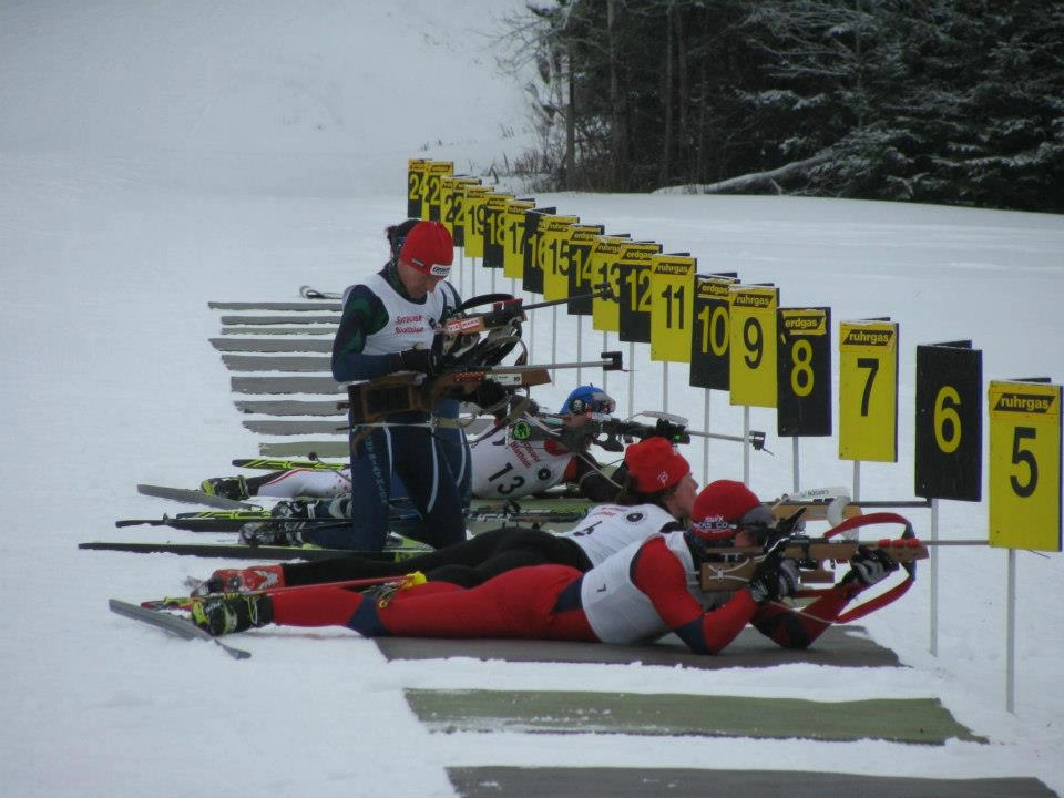 Biathletes on the firing range during competition at Mt. Van Hoevenberg
