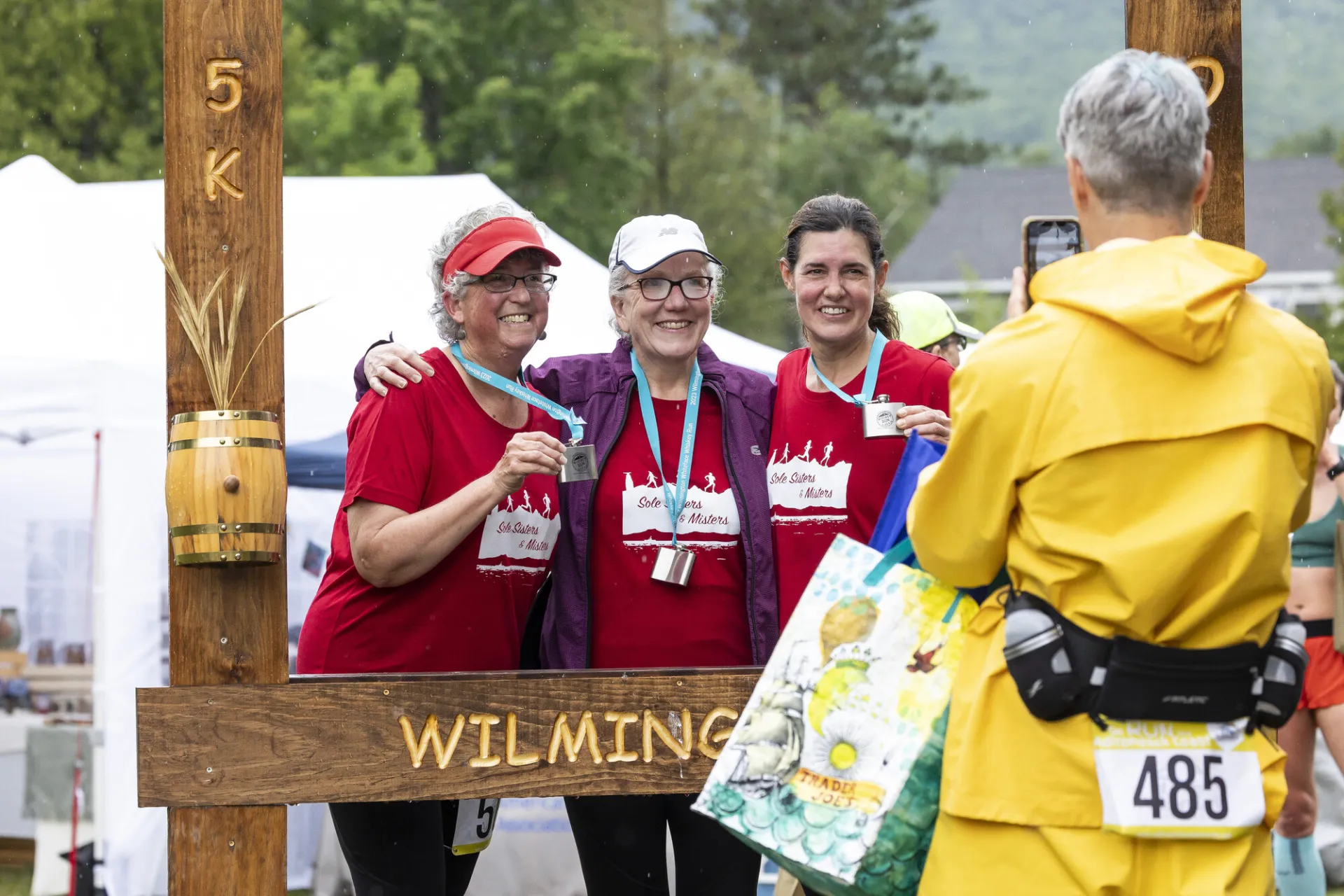 Racers get their photo taken in Whiskey Run photo frame