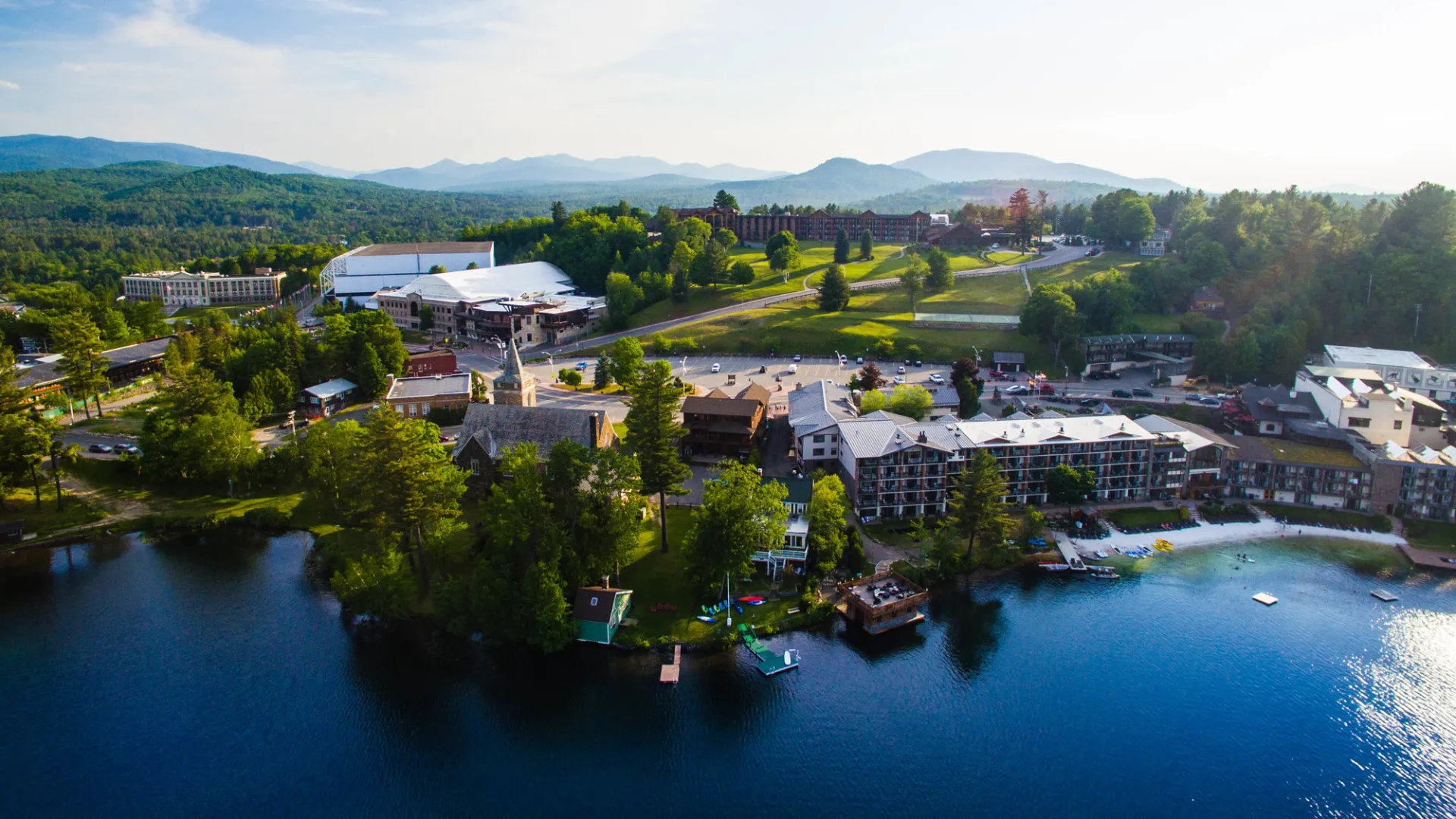 An aerial image of a small town on a lakeshore.