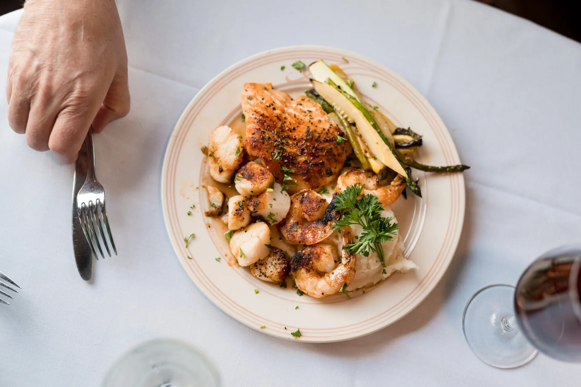 A plate of food on a white tablecloth.