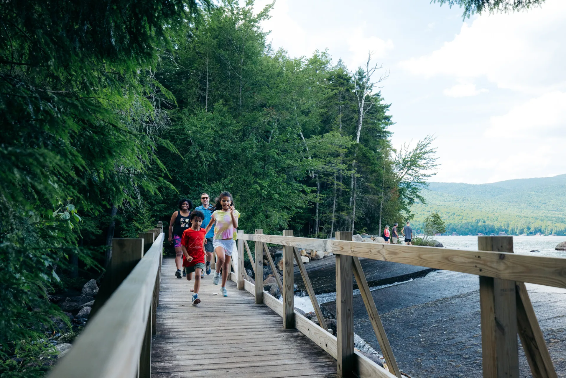 A family on a nature walk in Lake Placid.